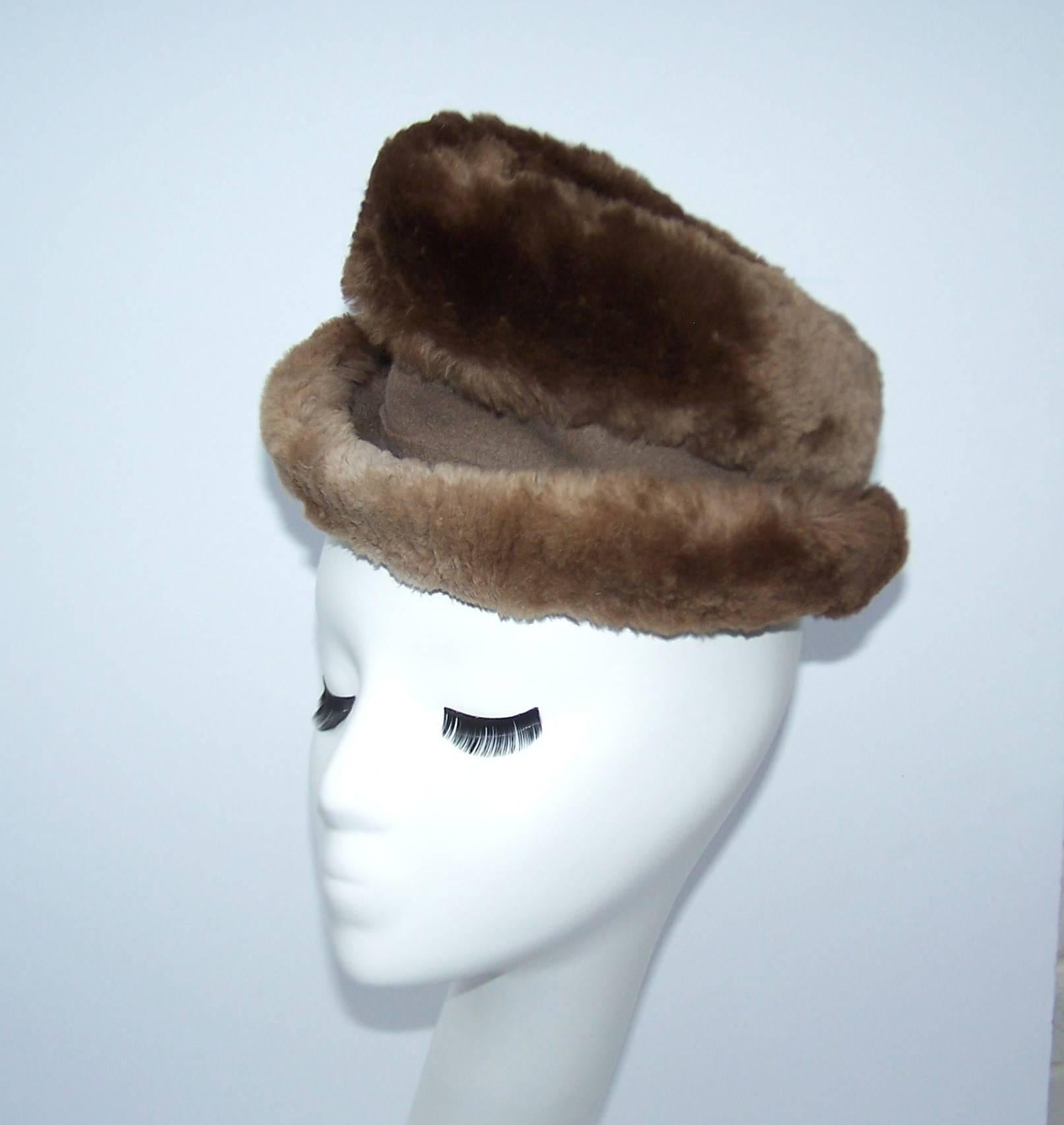 Soft and stylish ... this Rose Kraysler hat from the 1940's is so fun to play with.  The body is made from a neutral mousey brown wool felt and trimmed in sheared beaver fur creating texture and volume.  The pointed crown is exaggerated and looks