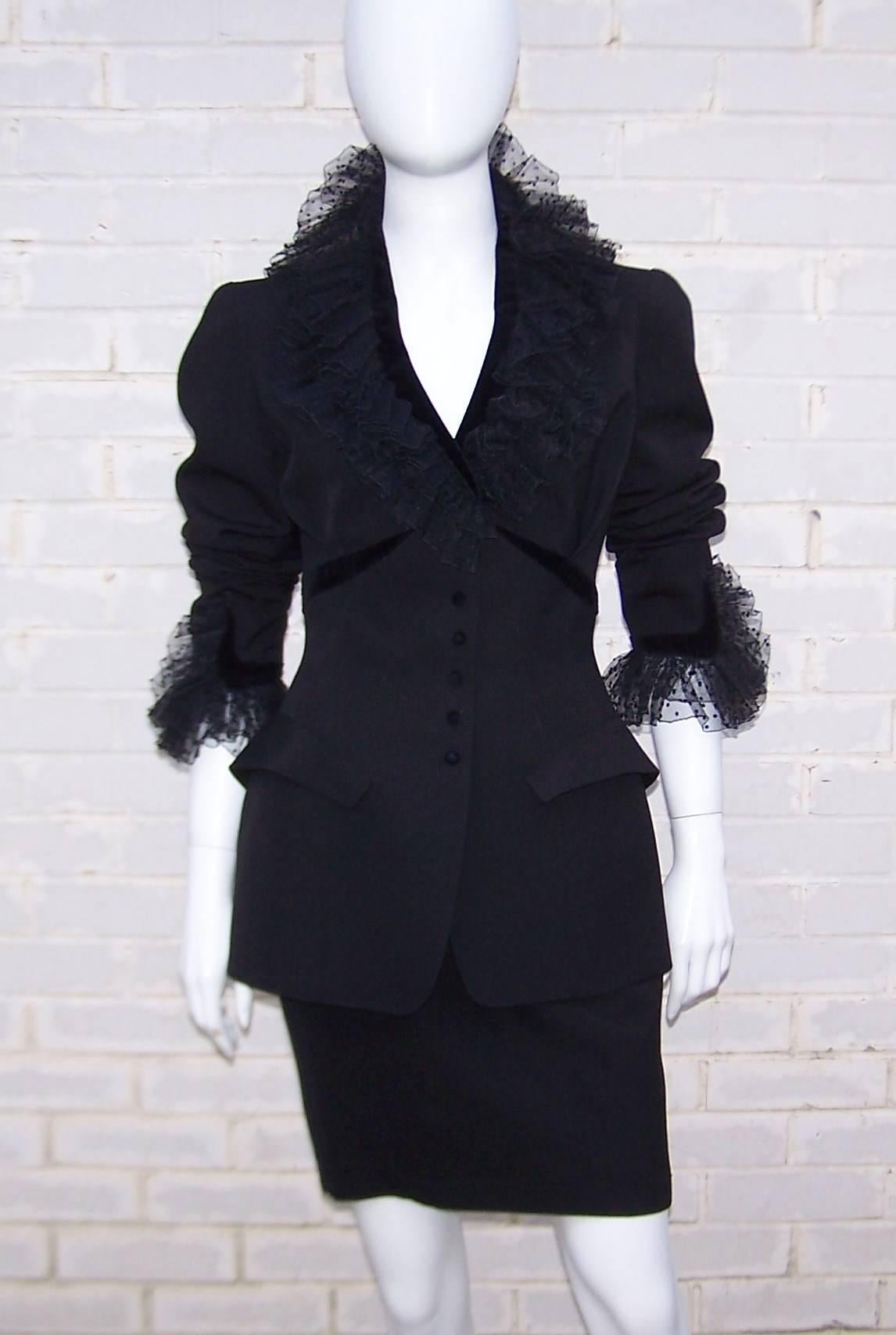 Oh the dramatic details are endless in this Thierry Mugler black jacket and skirt suit.  The strong 1980's influence is evident though there is a turn-of-the-century flavor to the details such as the dramatic dot netting at the collar and cuffs. 