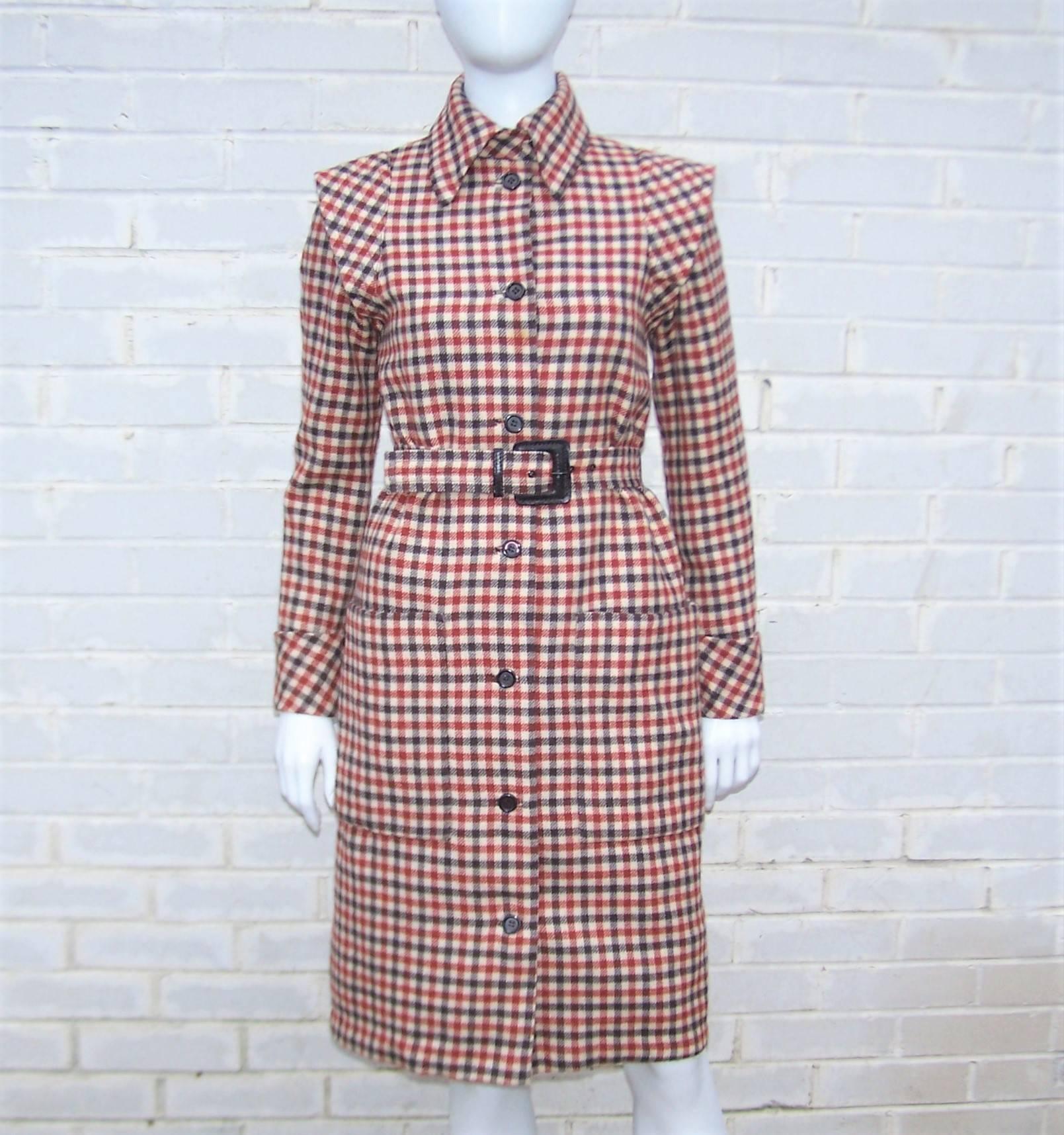 There is something decidedly futuristic about Geoffrey Beene's 1960s take on the classic coat dress.  The preppy brown plaid is an old school touch but the winged details at the top of the sleeve and the exaggerated tab collar provide a space age