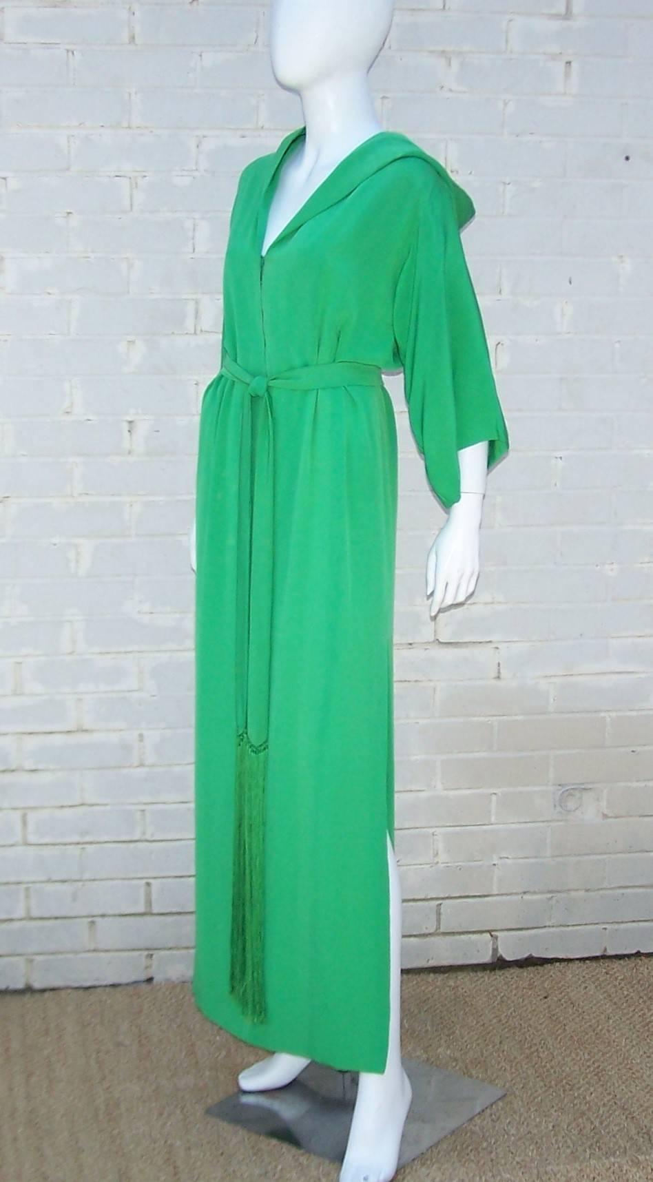 Glamour alert!  This high style 1960's Givenchy green silk faille robe is reminiscent of the golden Hollywood era when you put on your biggest diamond and brightest red lipstick to sit around the pool.  The robe partially zips at the front with