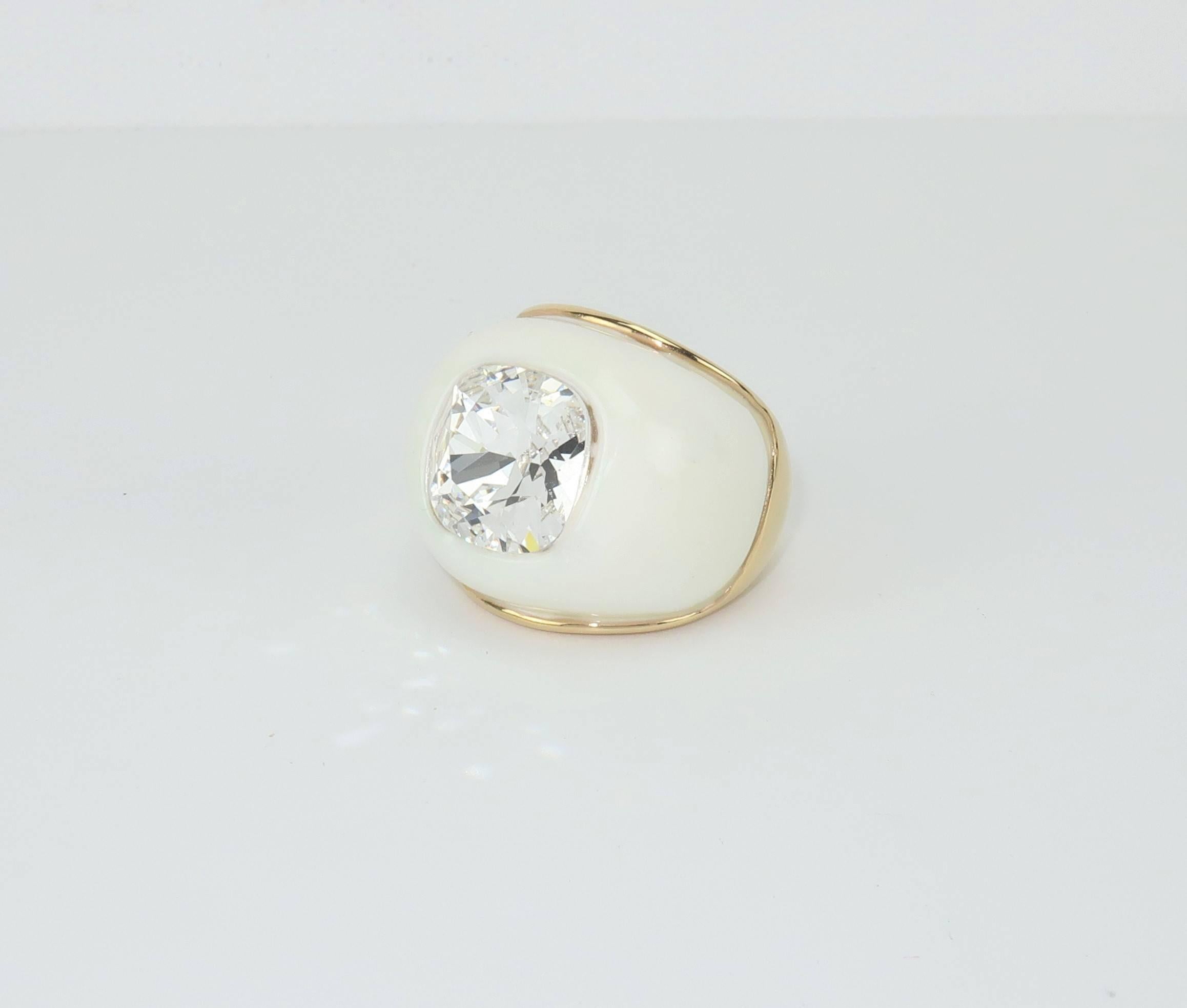 Kenneth Jay Lane's jewelry has always been defined by bold and dramatic designs that earned him the reputation of successfully making faux jewelry chic.  This contemporary white dome ring stands out not only for its chunky size but also for the
