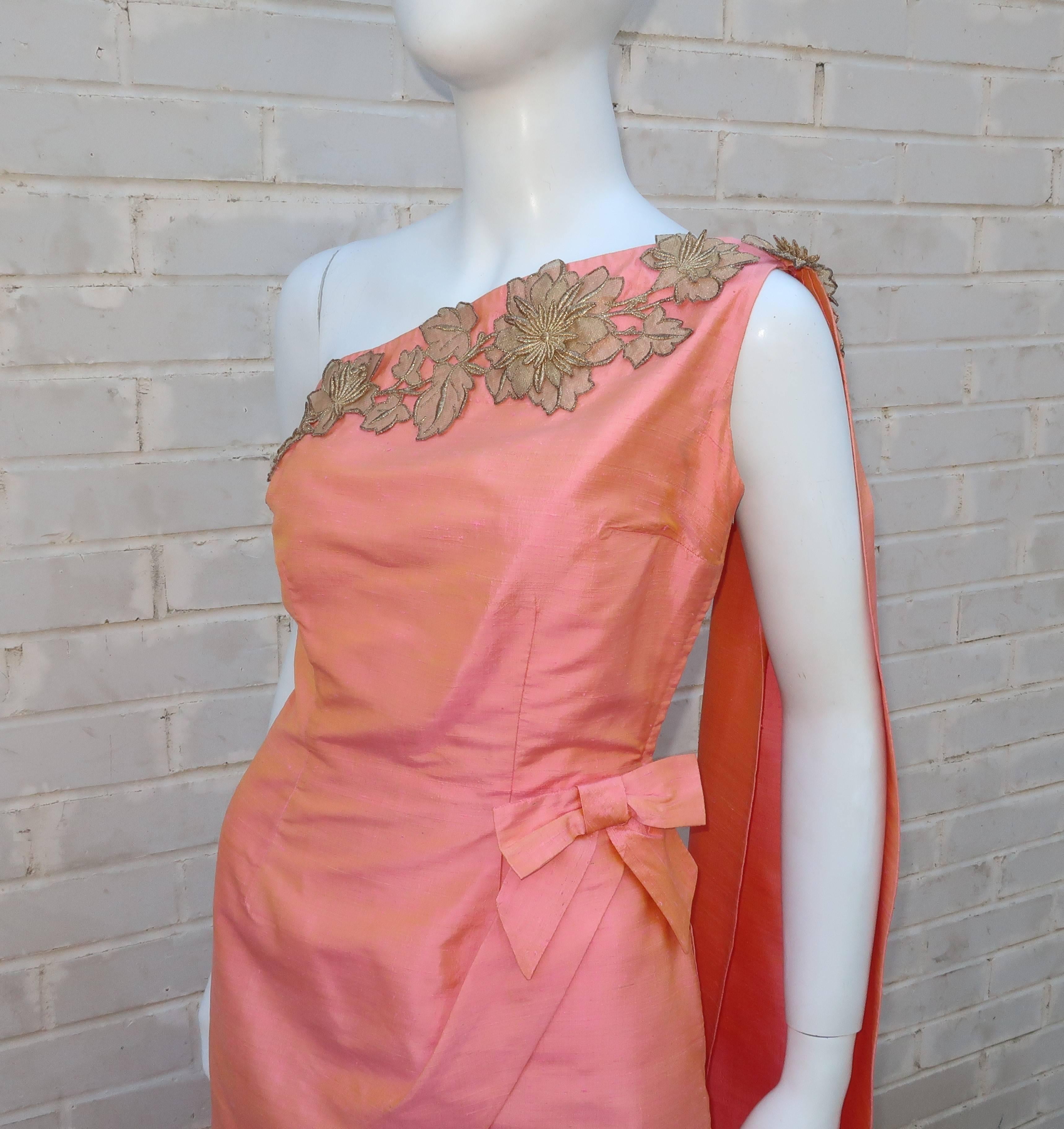 Don this 1950's custom made one-shouldered dress and bring out your inner goddess for an evening under the stars.  Everything about this heavenly silhouette is designed to emphasize the feminine form all wrapped in a peach dupioni iridescent silk