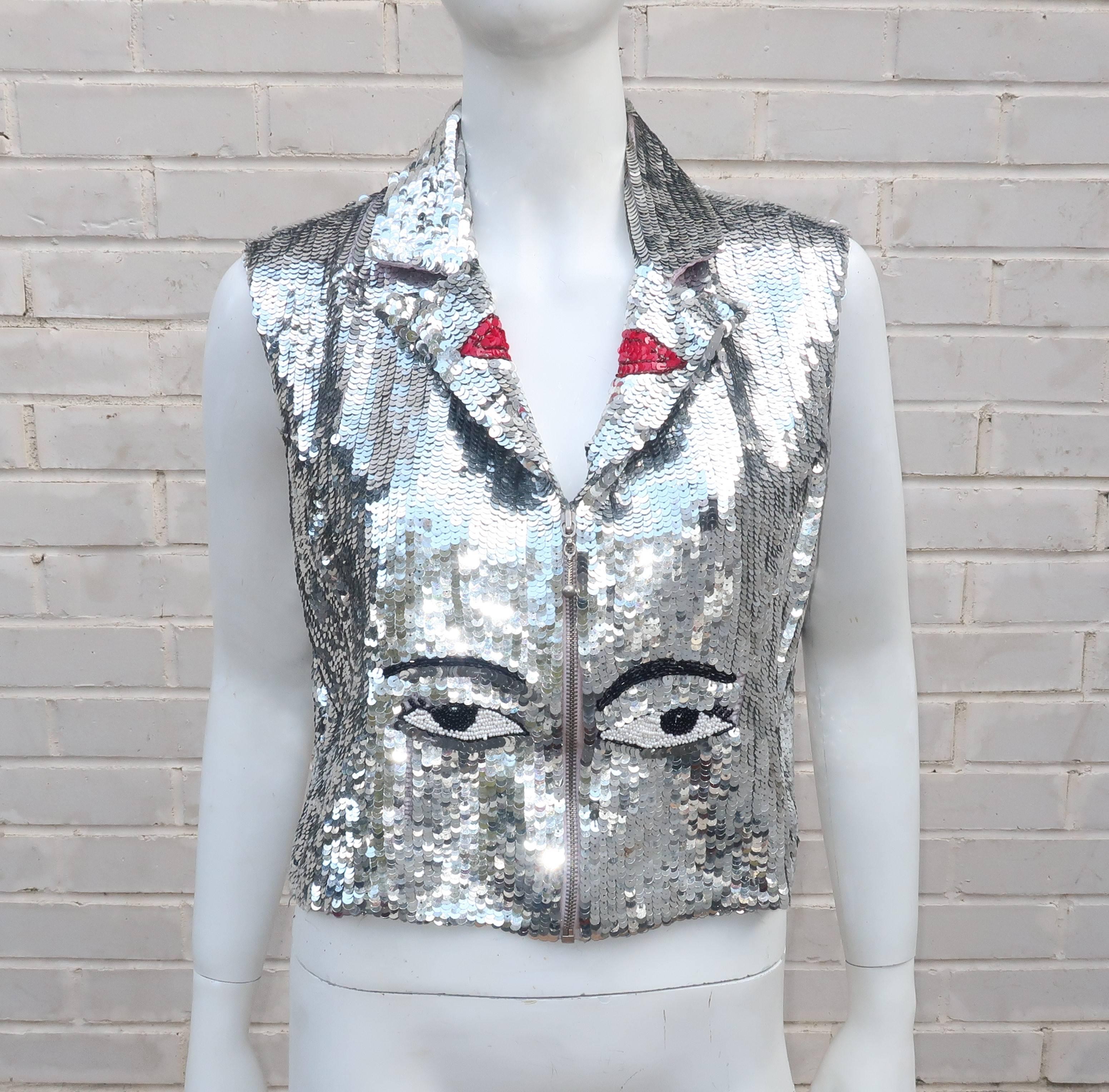 They'll be looking at you while your vest is looking at them!  This fully sequined 1980's disco silk vest by Modi features black and white beaded eyes at the front and a winking face at the back.  The boxy silhouette closes at the front with an