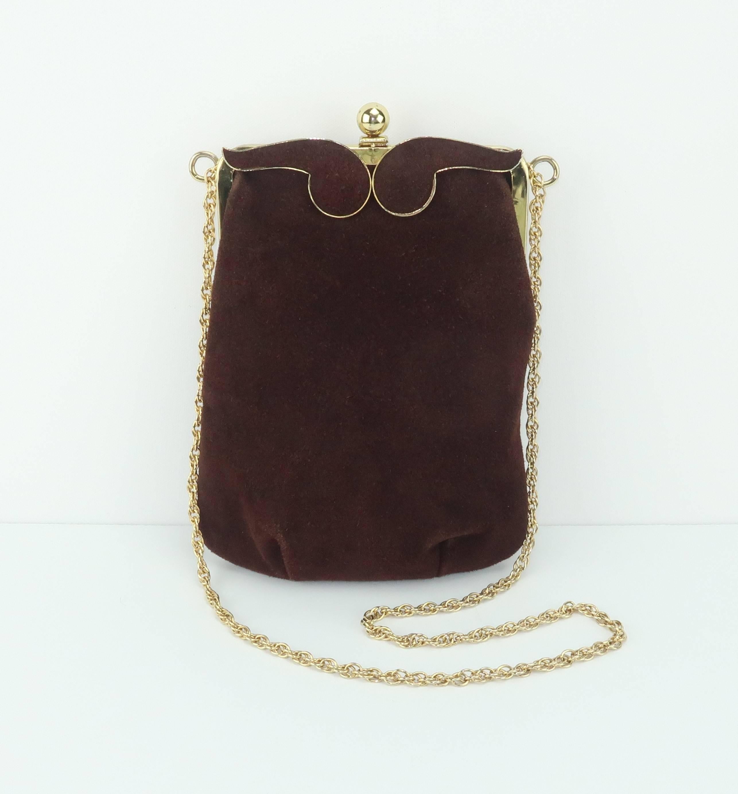 The details on this brown suede handbag by Triangle, New York are eye catching and as fashionable today as they were in the 1960's.  Triangle had a reputation for producing affordable handbags with unique features that mimicked the higher end