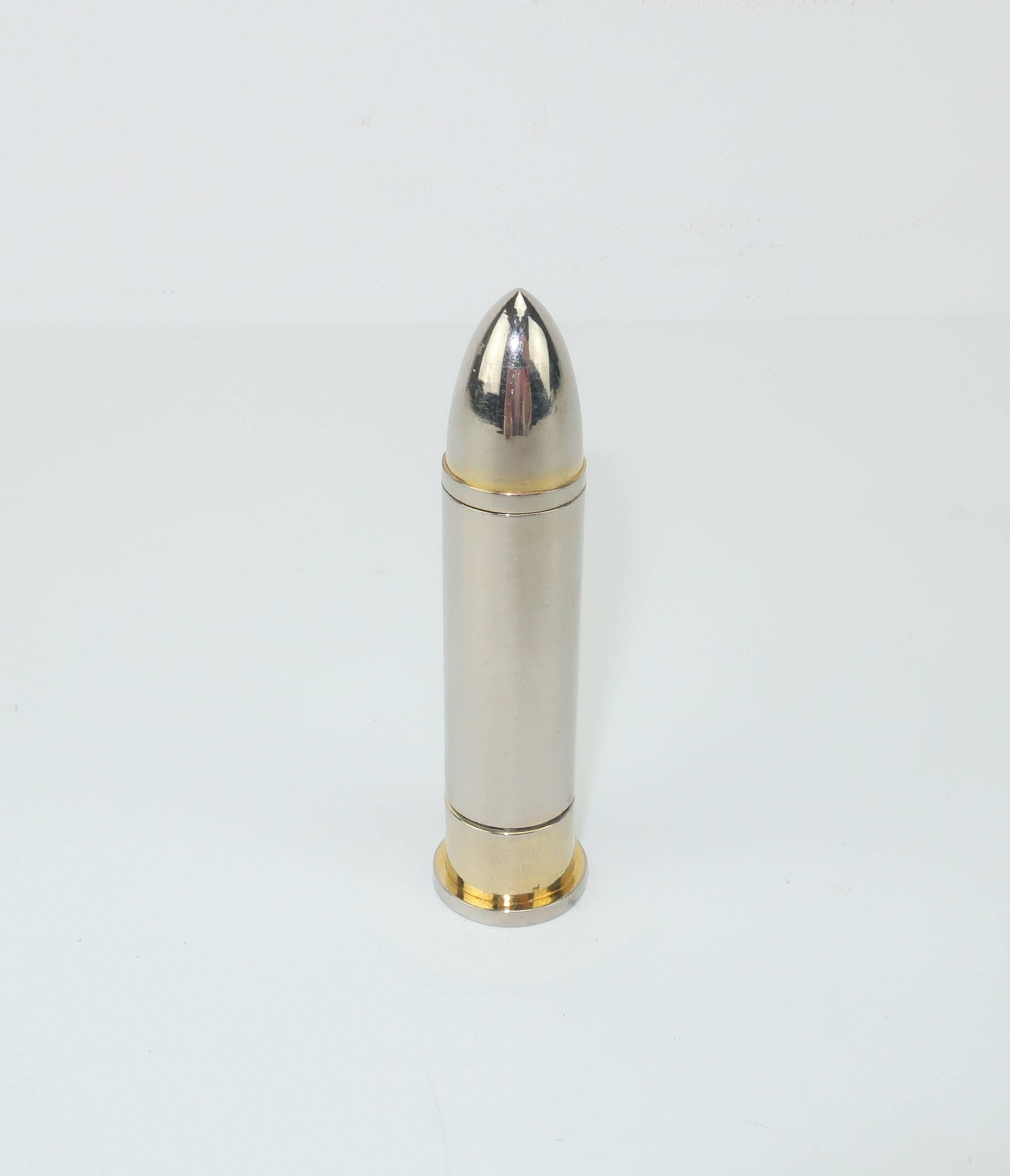 Maybe this is a clever social commentary about pill popping but one thing is for sure ... it is clever!  This chrome realistically styled modernist bullet unscrews at the top to reveal a hollow interior perfect for toting a few aspirins.  Both the