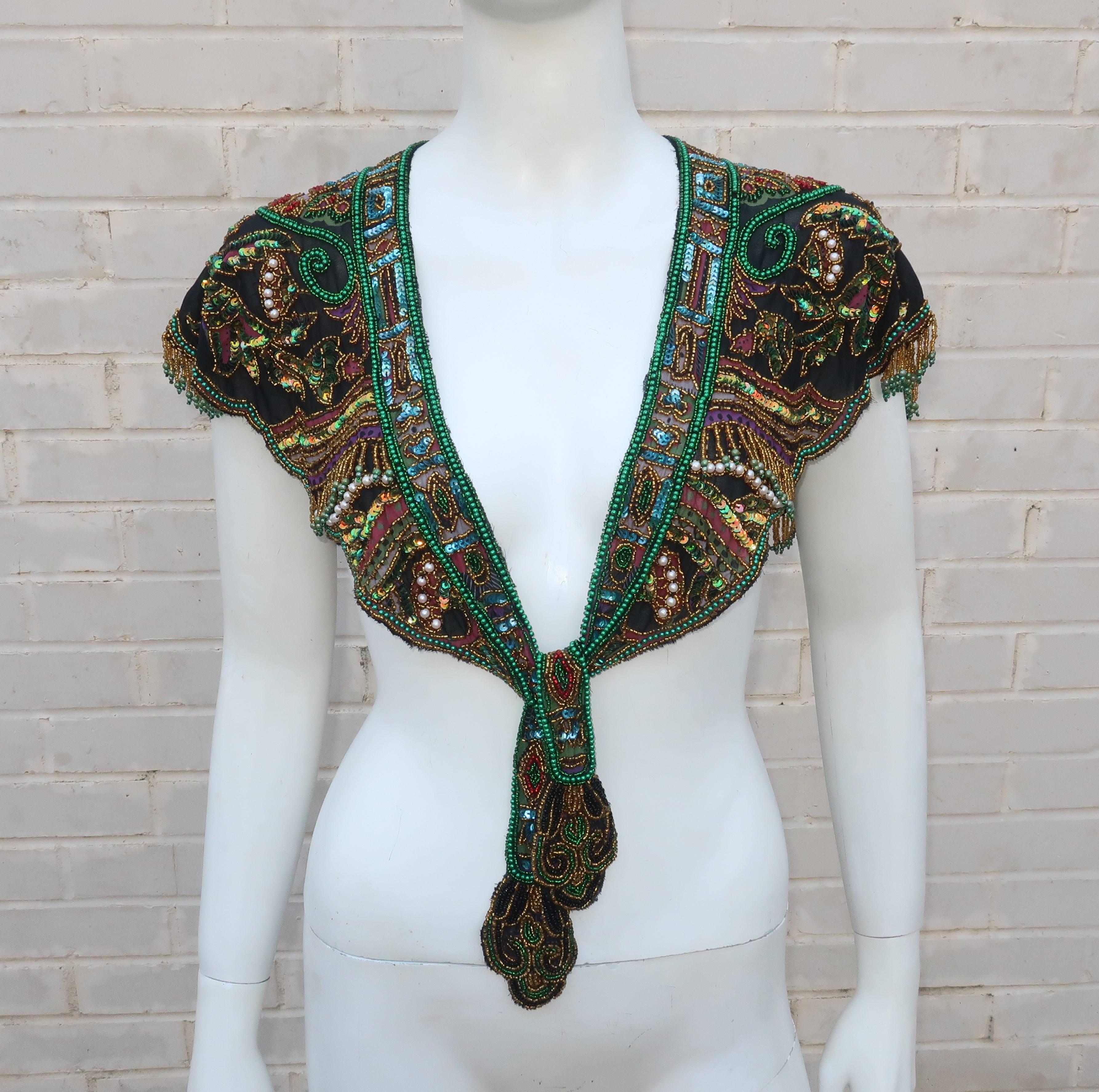 What a beauty!  This rayon chiffon 1970's collar is heavily beaded and draped with a nod to the Egyptian Revival style.  The underlining chiffon fabric is dyed with dark jewel tone colors including midnight blue (almost black), purple, magenta and