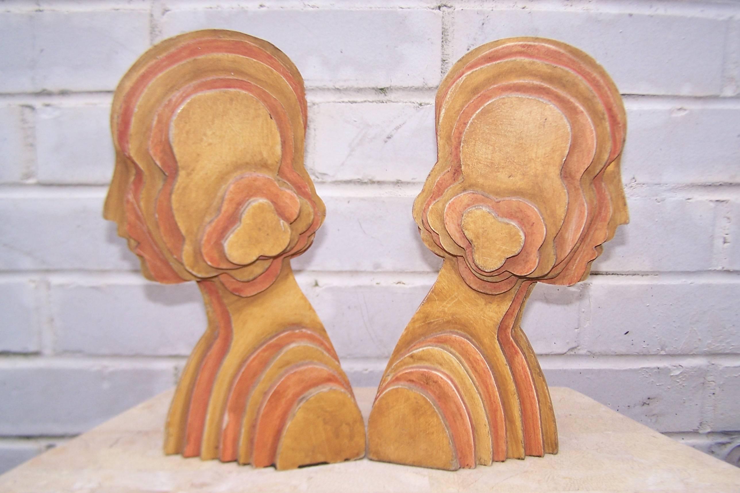 Bookends or sculptures? Why not both? All your bases are covered with these C.1970 art deco inspired flapper bookends created from layered wood pieces. Muted orange and yellow colors finish off the mod 70s vibe for a unique addition to your