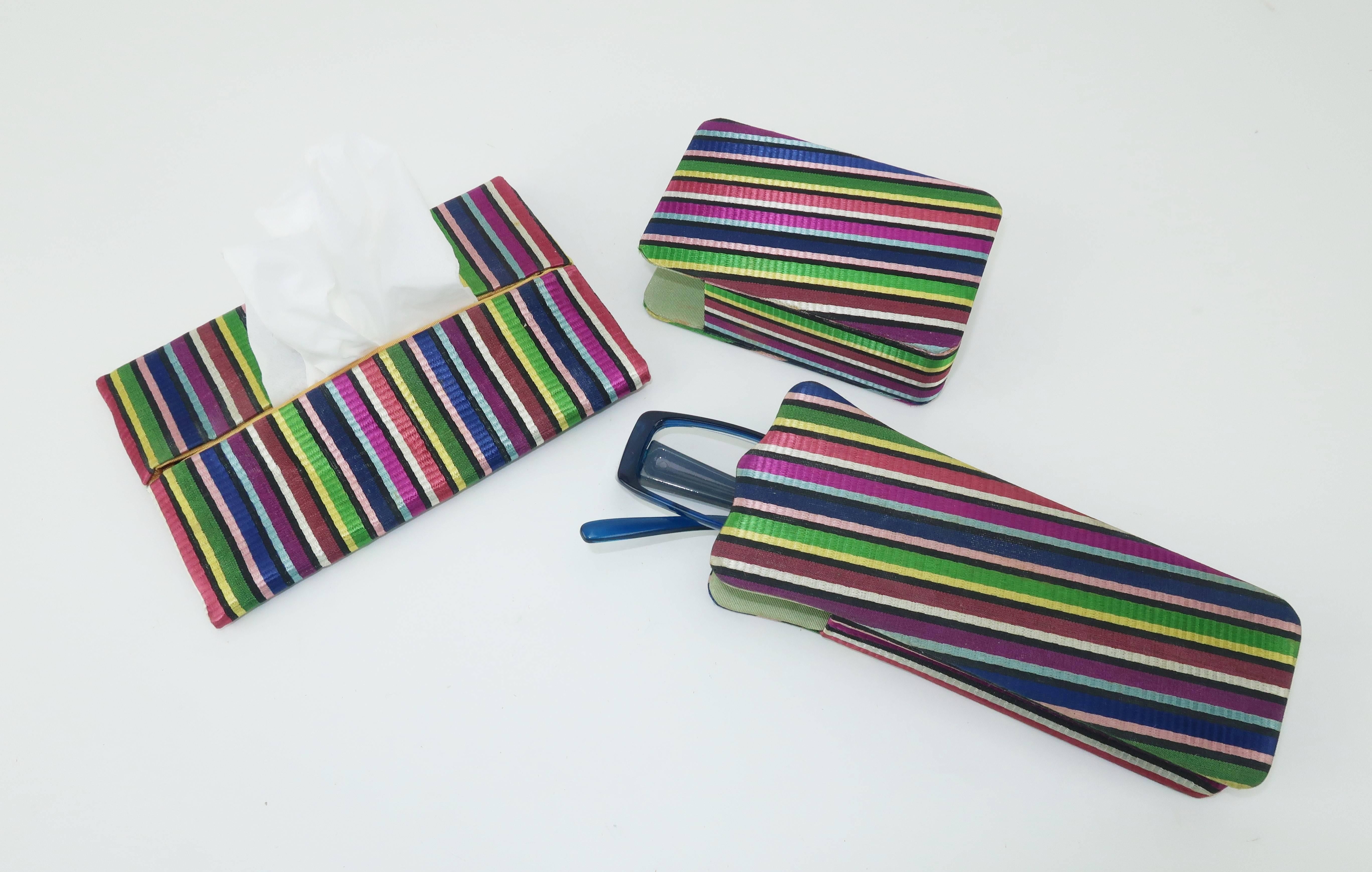 This cute 1950's three piece set is loaded with charm.  The coordinating jewel tone textured stripe is reminiscent of satin ribbons and incorporates colors ranging from blue and green to magenta and yellow.  The set consists of a cigarette box,
