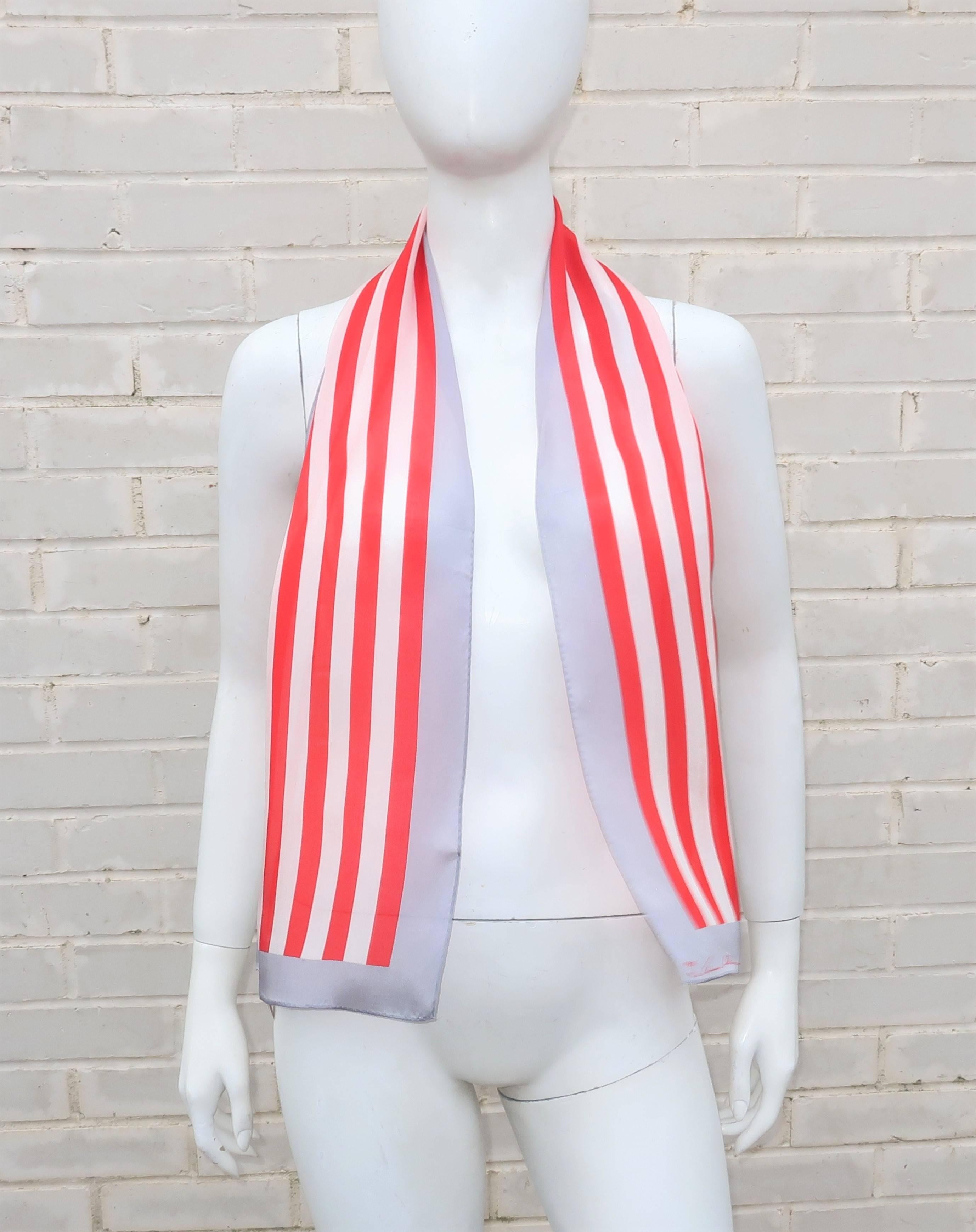 This wispy silk scarf combines two powerhouses of American fashion ... Anne Klein and the Vera Companies.  The vibrant fusion of candy cane red and white stripes is bordered by a dove gray band giving the extra long scarf an Americana feel. 