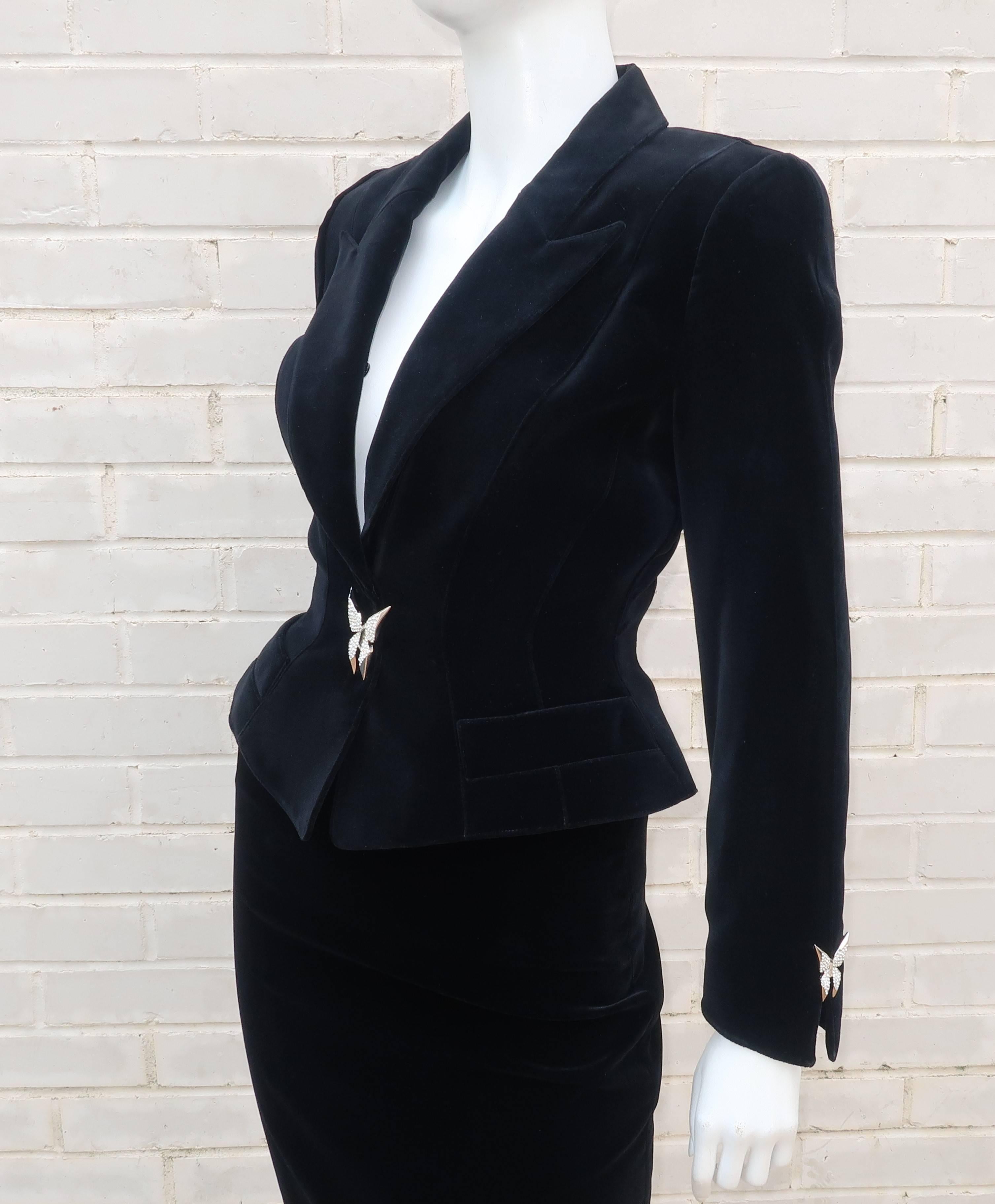 French designer Thierry Mugler is a master of the innovative suit combining style details from the 1940's with a futuristic silhouette which honors the strong feminine form. This gorgeous wasp waist black evening suit incorporates the tactile