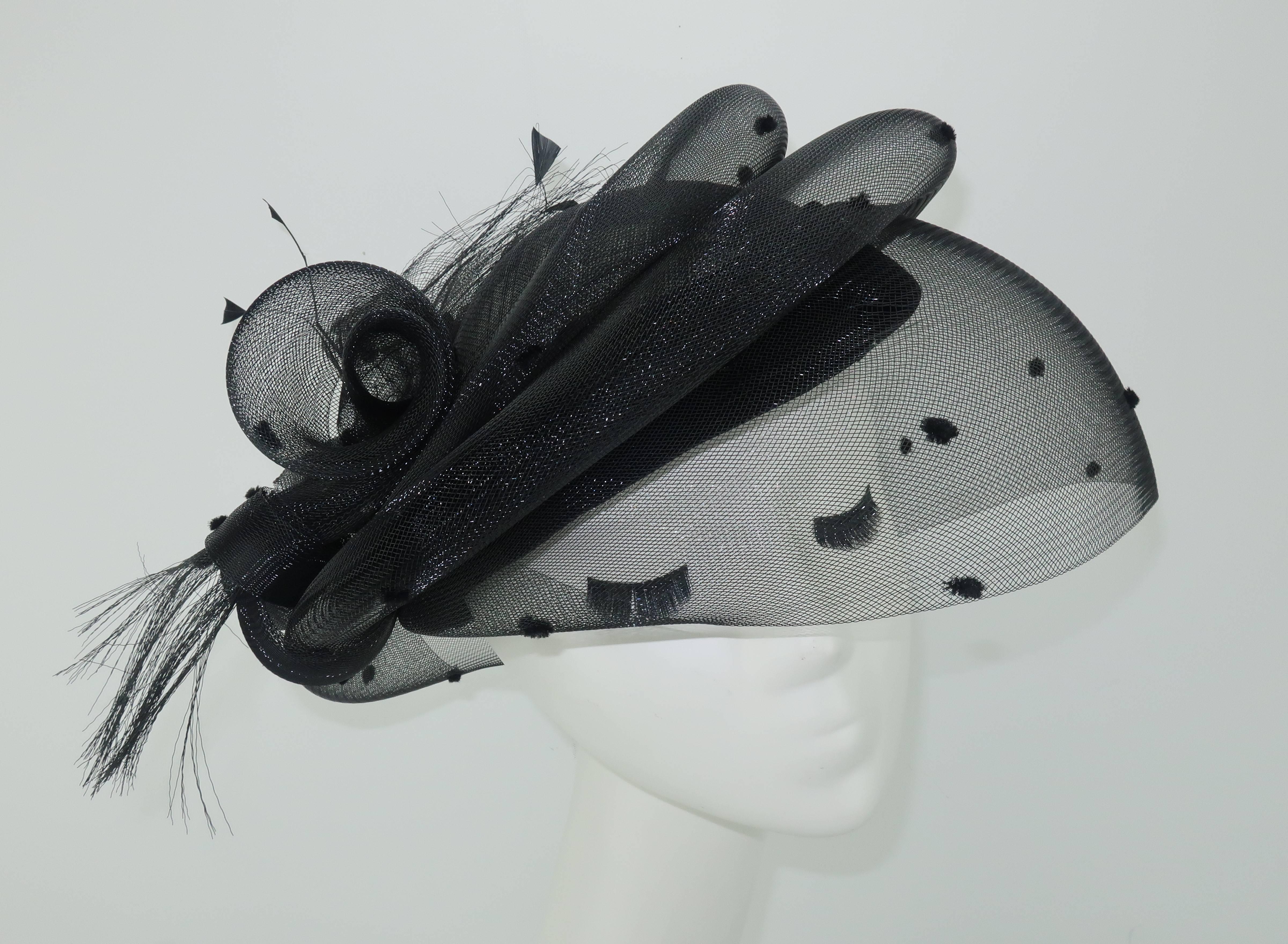The Italian milliners, Marzi, have been creating hats since the 1920's ... adorning the heads of fashionable ladies with everything from daytime straw creations to elegant formal toppers.  This sculptural sensation is of the latter style with a