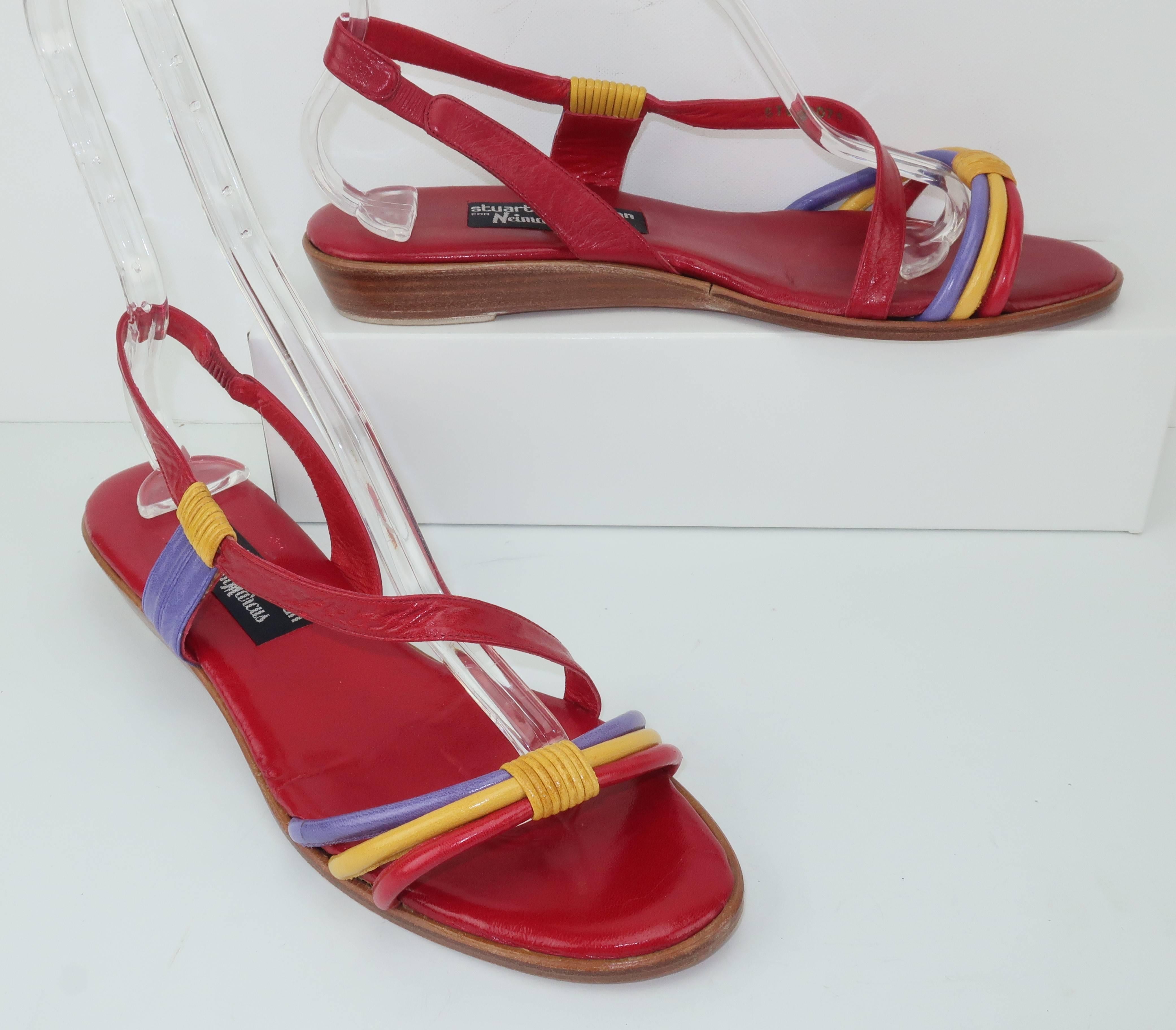 The only thing better than an awesome shoe is a comfortable awesome shoe!  These colorful leather sandals have a slingback style with a crossover strap and a stacked wooden wedge 1