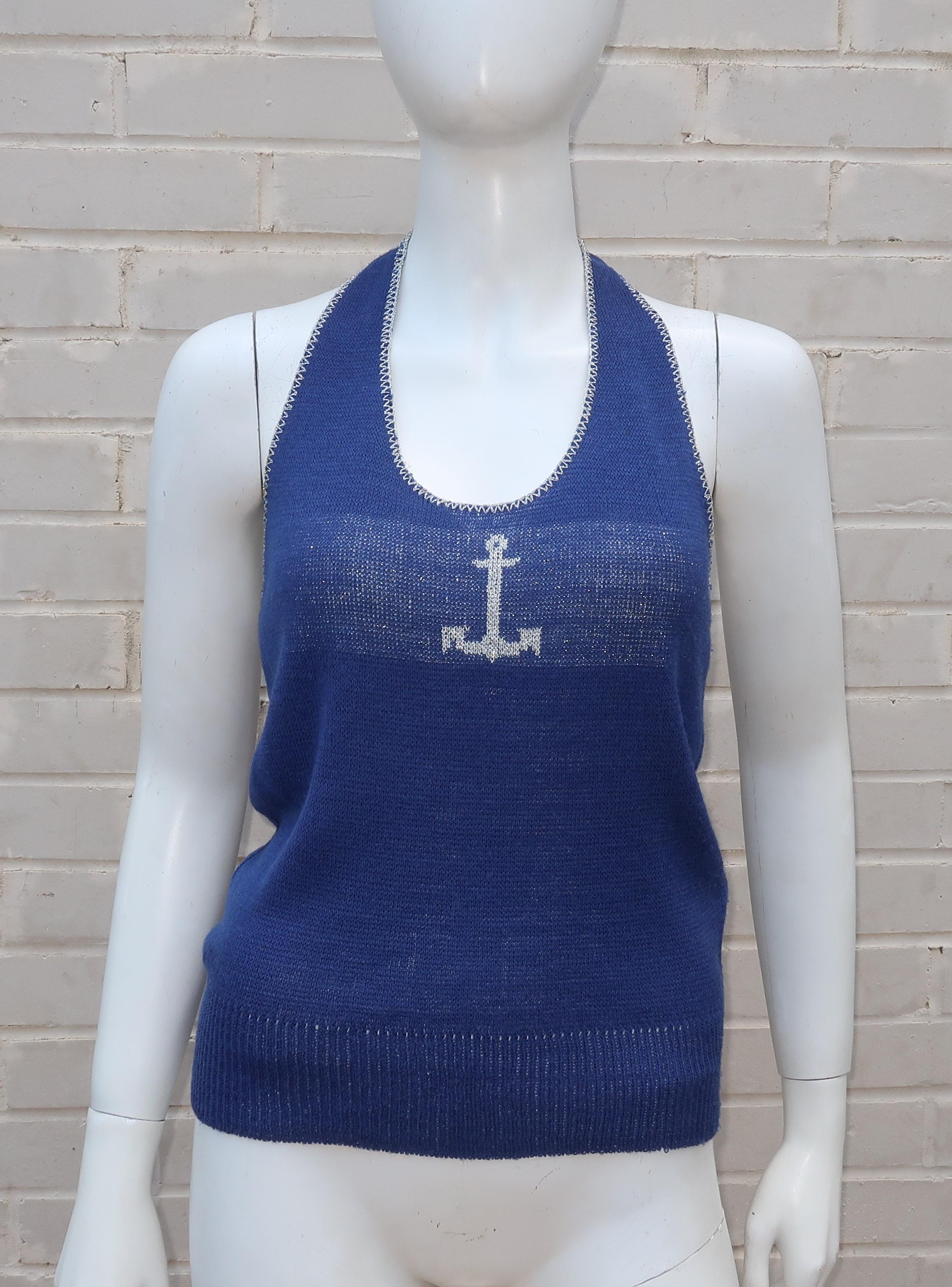 Ship ahoy and anchors away!  This 1970's halter top by Pandora is a period perfect pairing for summery white shorts and pants.  The blue acrylic knit is embellished with silver metallic threading at the neckline and across the bust with a decorative