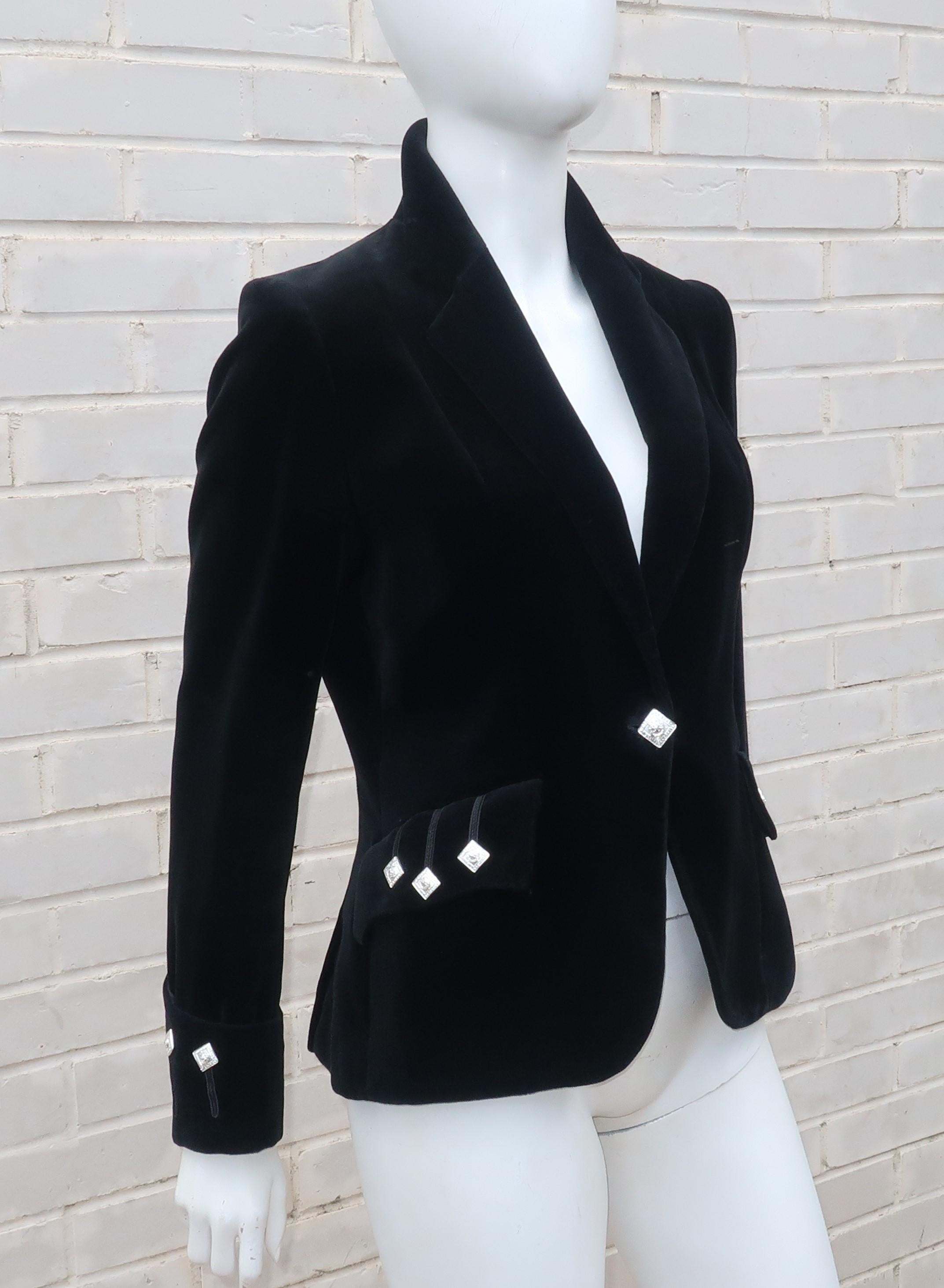 This black velvet ladies topper has the traditional details of a Scottish kilt jacket.  It buttons at the front with flap pockets and detailed wide cuffs all adorned with silver Scottish clan buttons.  Perfect to pair with your favorite tartans or