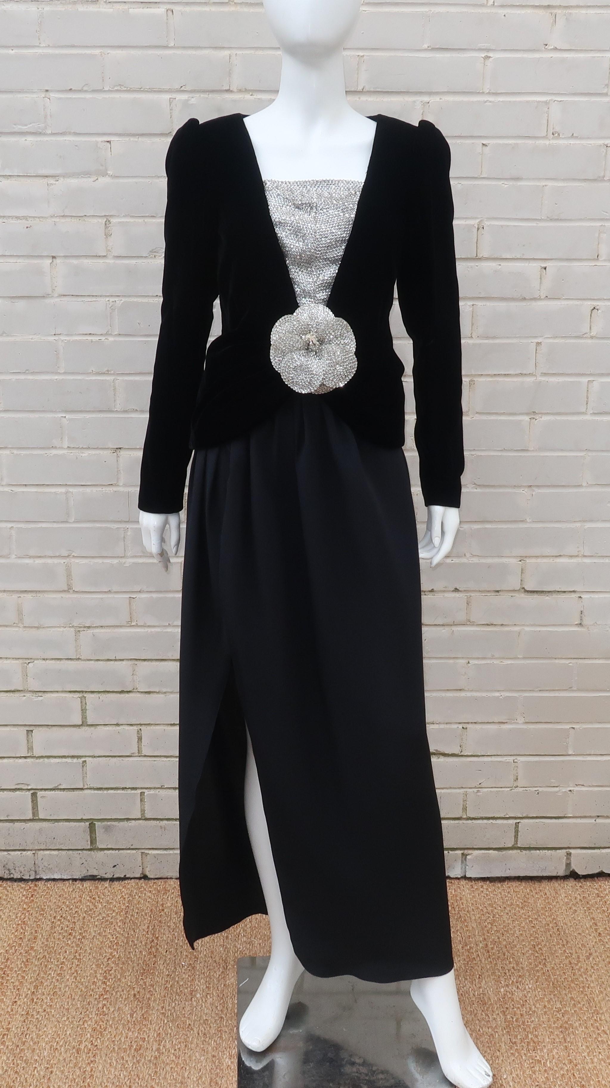 Oh the luxury and opulence of a evening ensemble by the master of feminine designs, Oscar de la Renta!  This two piece outfit consists of a long black silk skirt topped with a black velvet jacket adorned with a silver sequin 'bib' and a detachable