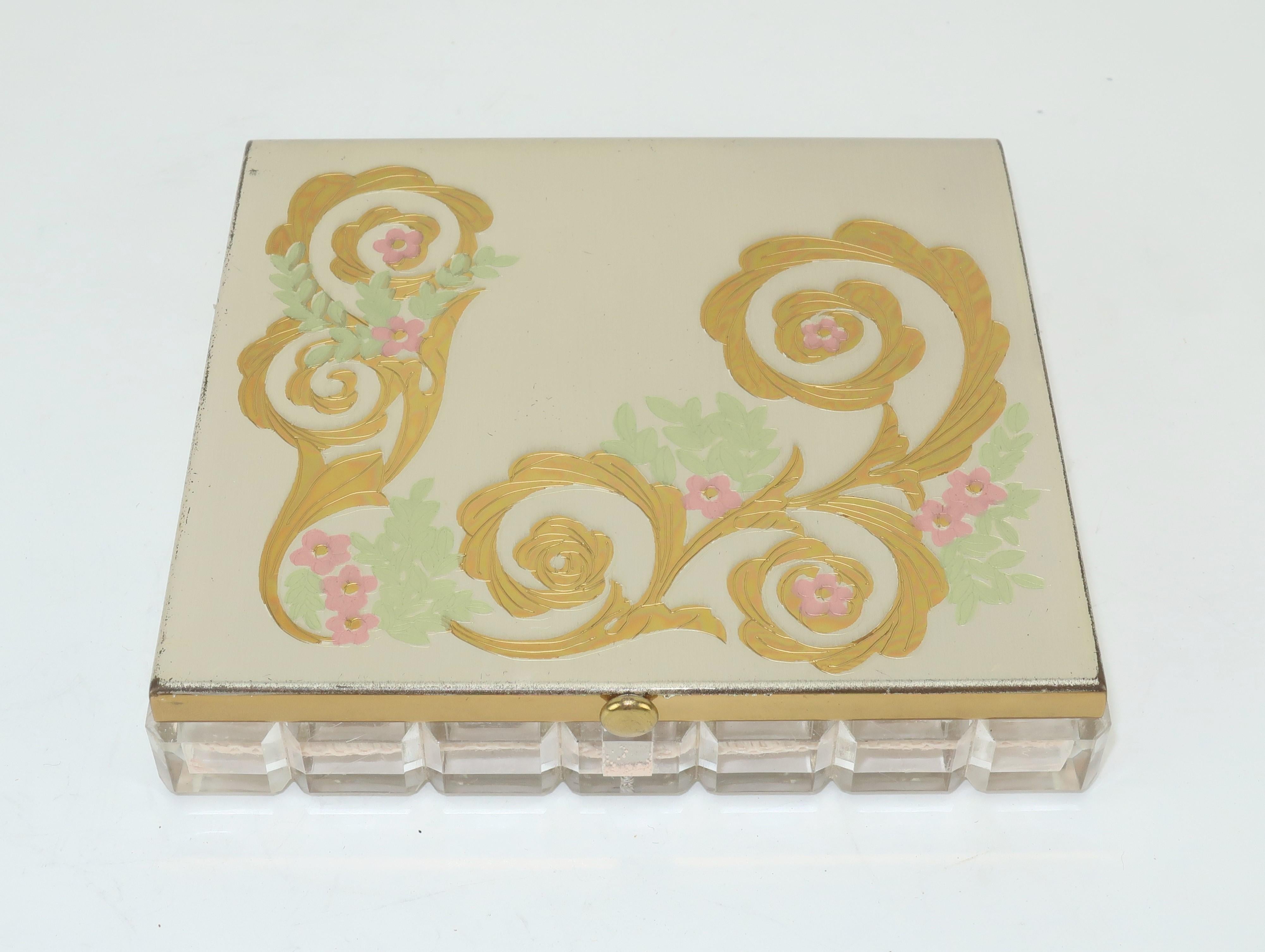 Much like chatelaines, mirrored compacts are feminine gadgets of a bygone era. This example from the American company, Wadsworth, is a powder compact with a charmingly glamorous look as fashionable today as it was in the 1950's. The lovely brushed