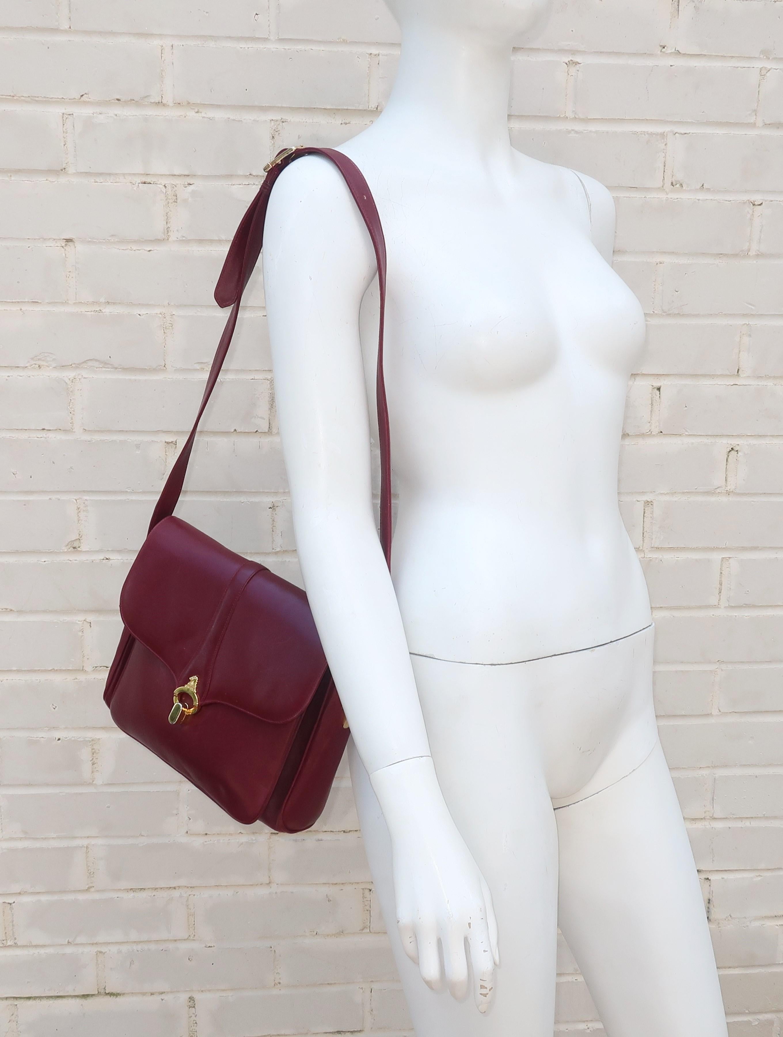 Mark Cross was founded in 1845 to create the finest leather goods for the horse and buggy rider and indeed much of the fashionable merchandise produced in the 1900's had the aesthetic of equestrian leathers.  This 1970's burgundy leather shoulder
