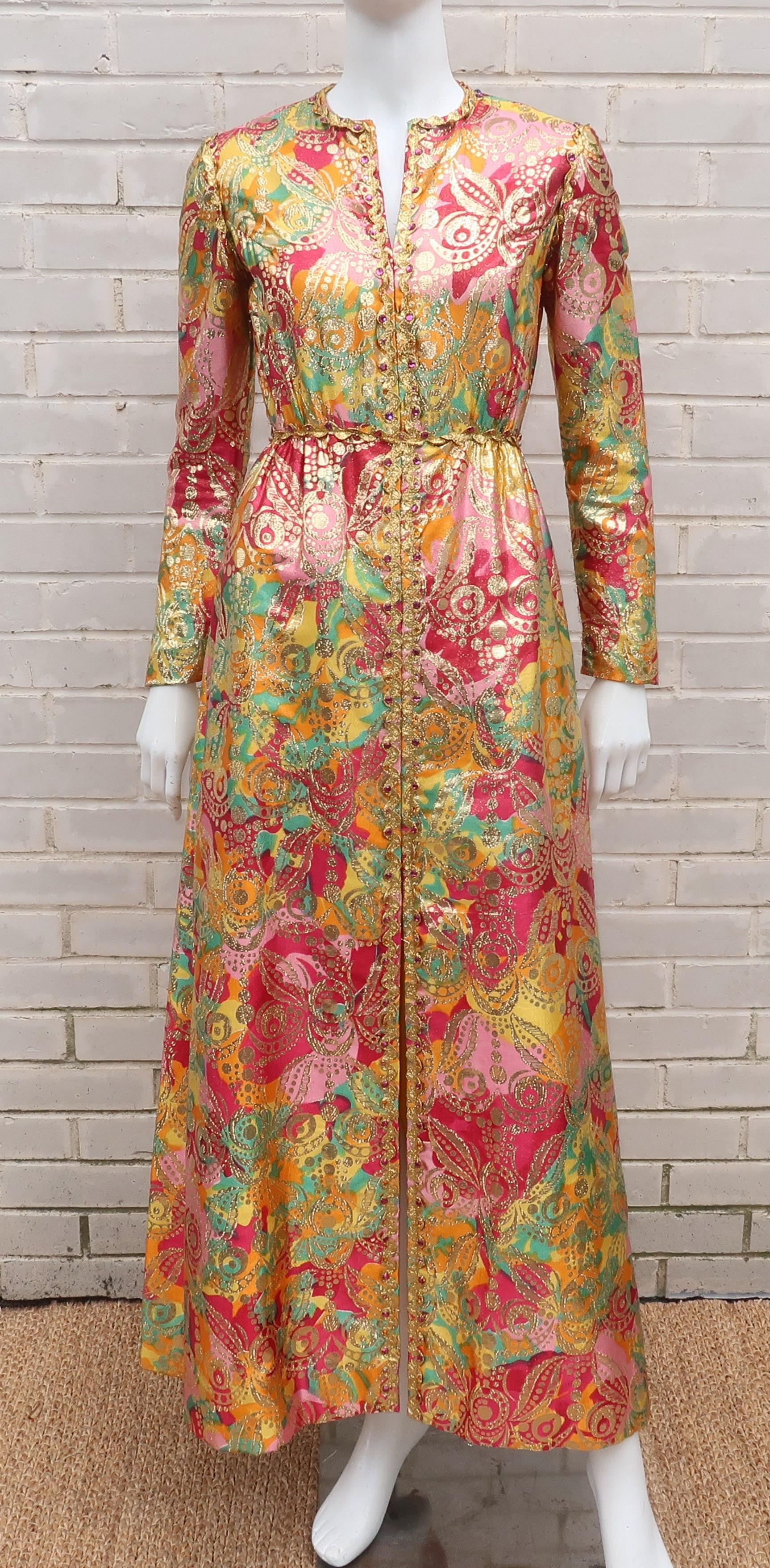 A somewhat simple silhouette is transformed to a dazzling evening dress by an abstract floral gold lamé fabric that gives a nod to 1960's period perfect psychedelia.  This Saks Fifth Avenue design zips and hooks at the back with gold rickrack trim