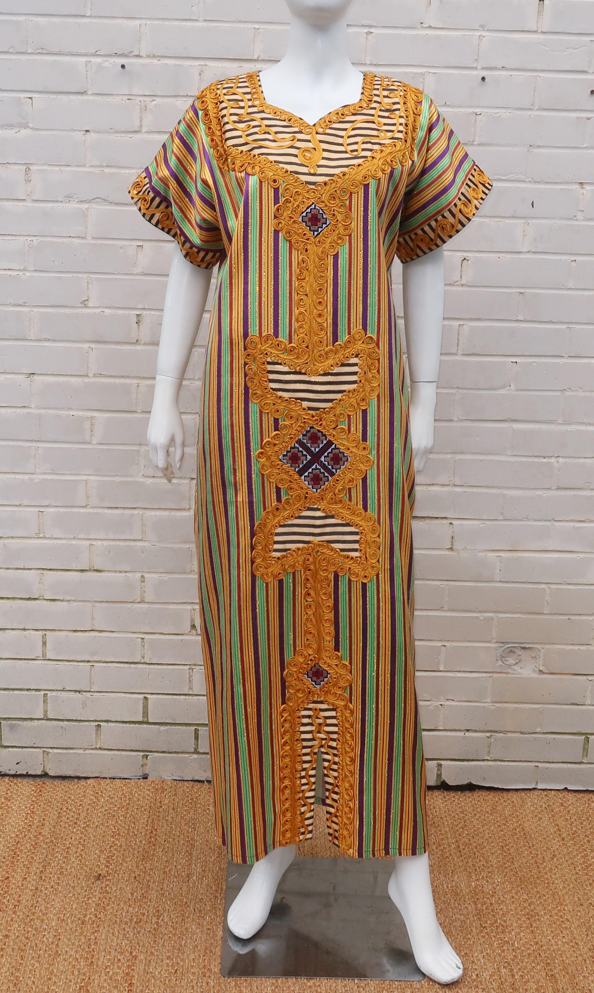 Relax like the Queen of the Nile in this exotic Egyptian caftan dress.  The rich heavy cotton fabric has a sateen finish in vibrant stripes of yellow, green, purple and red with gold metallic threading throughout.  The bib, front panel and sleeve