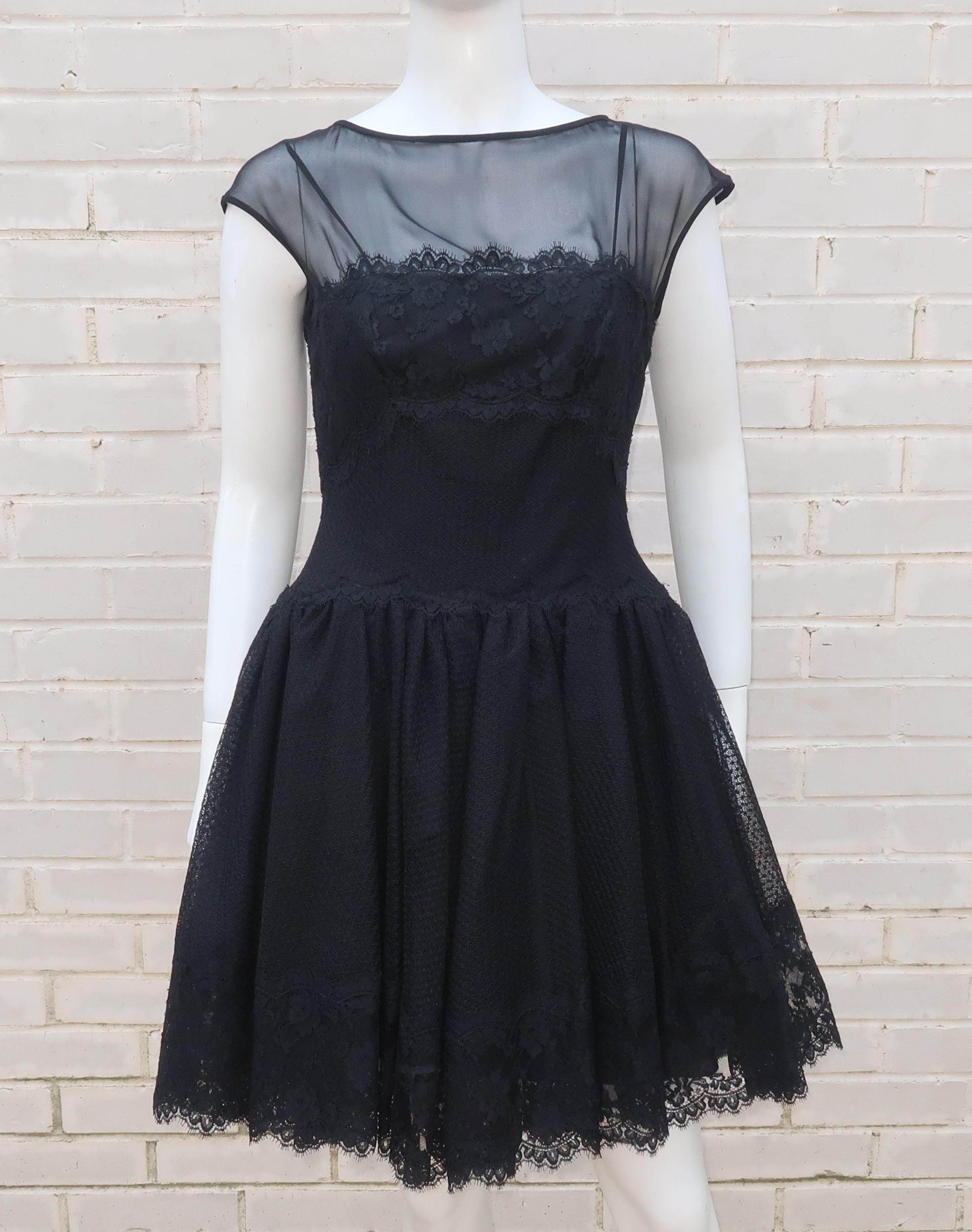This 'little black dress' by Stanley Platos & Martin Ross has a youthful countenance with ballerina style details to give it something extra.  The flattering silhouette is fitted at the boning lined bodice that features a drop waist skirt