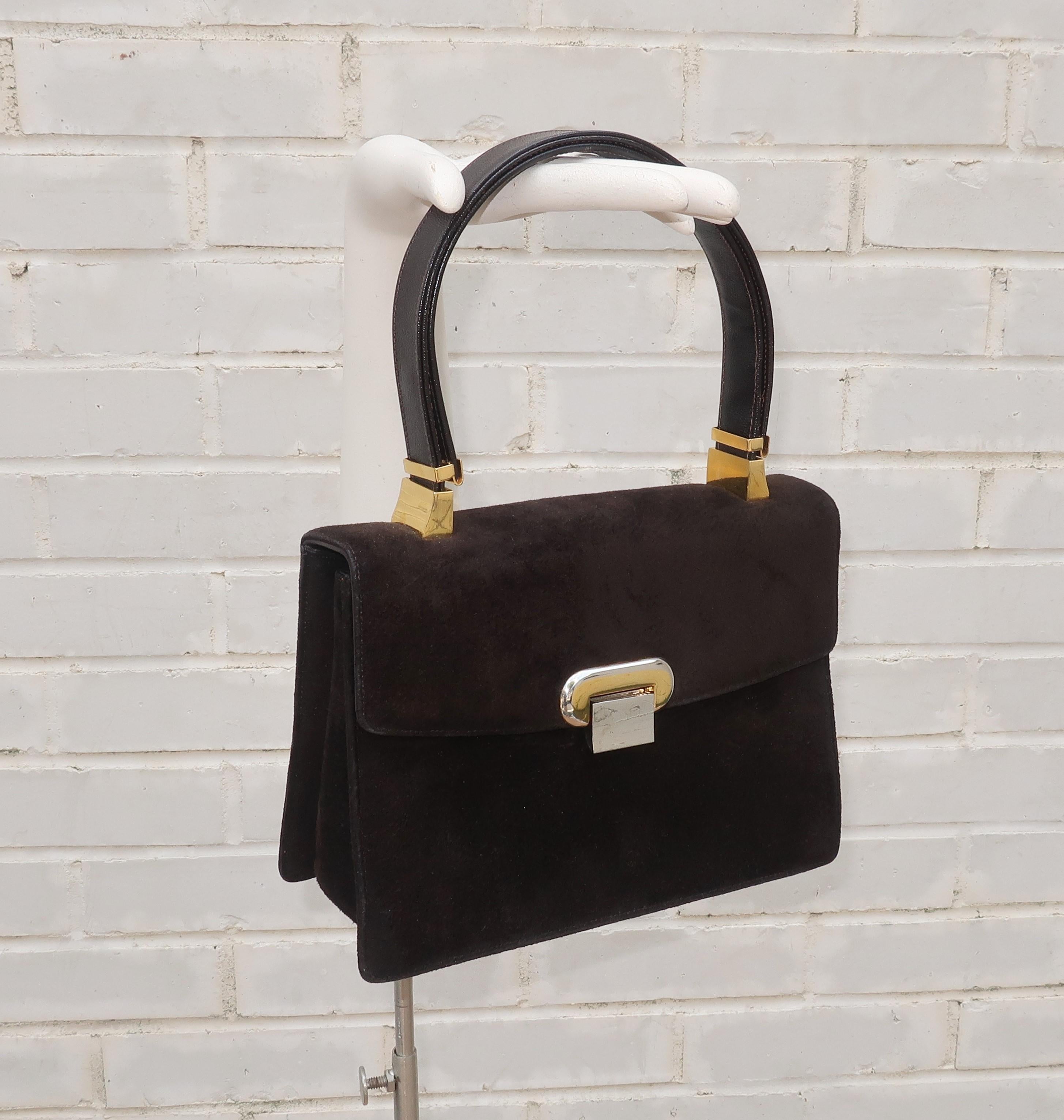 Koret started producing fine handbags in 1929 and ushered in every decade with stylish designs fabricated from quality materials which sold in upscale department stores and boutiques.  This 1960's dark brown suede handbag has the sophistication of a