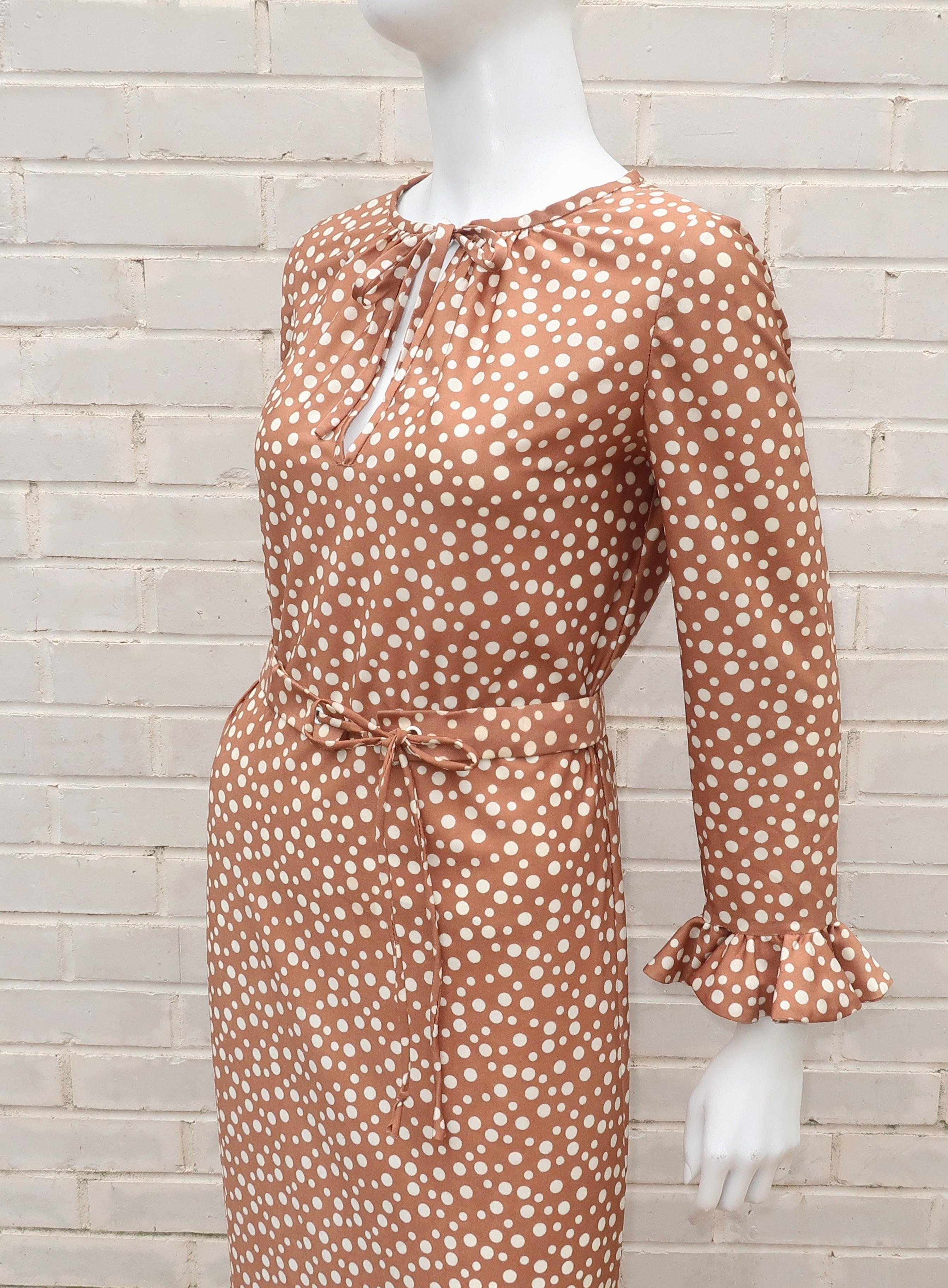 This C.1970 Jane Andre pullover dress offers an easy silhouette with stylish details.  The polyester jersey fabric has the weight and feel of silk providing comfort perfect for day wear that can be dressed up or down depending on the occasion.  The