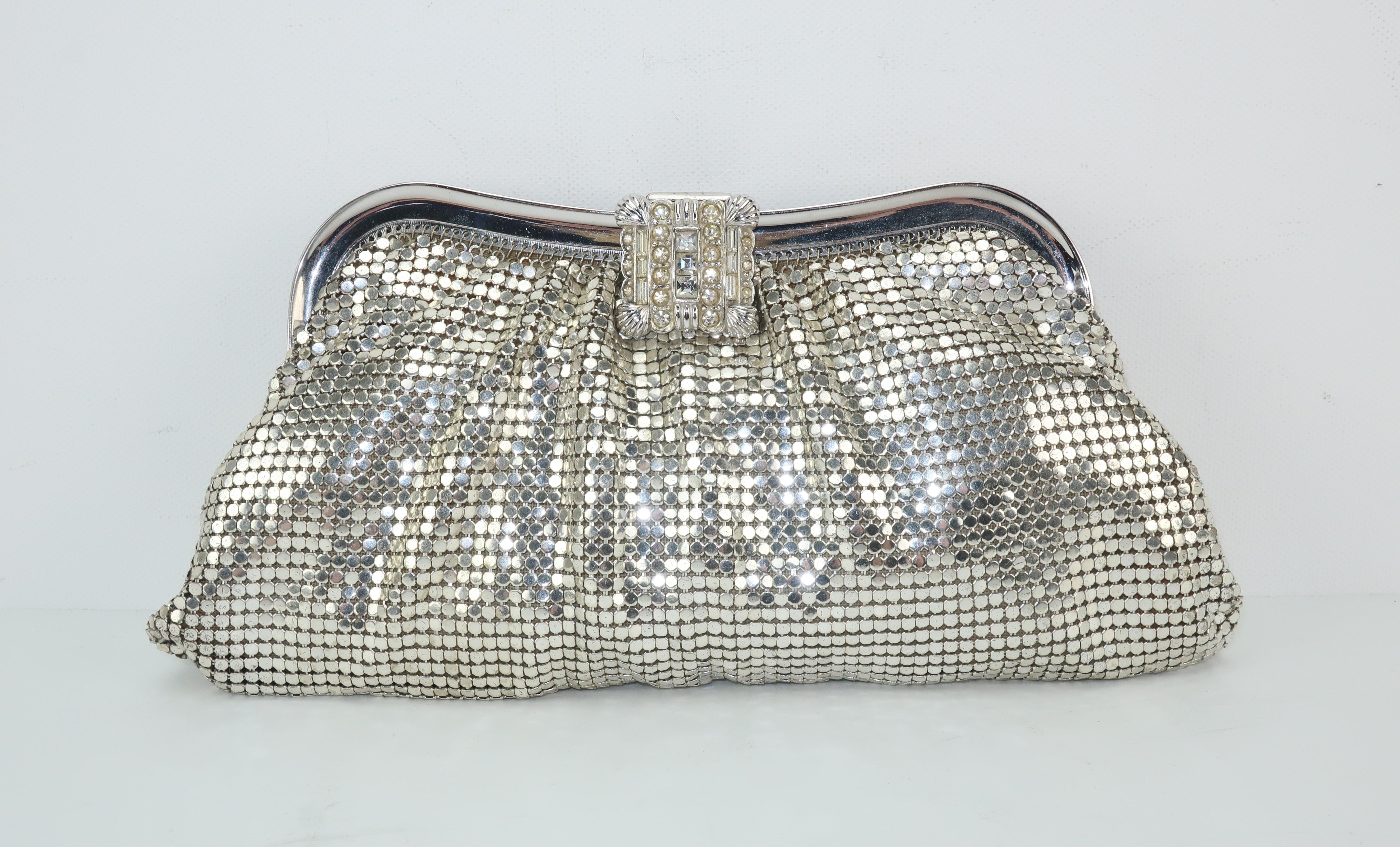 This glamorous silver mesh evening handbag by Whiting & Davis will take you from deco to disco!  Whiting & Davis has been producing fashionable handbags since the late 1800’s and their signature mesh designs represent classic American glamour. The