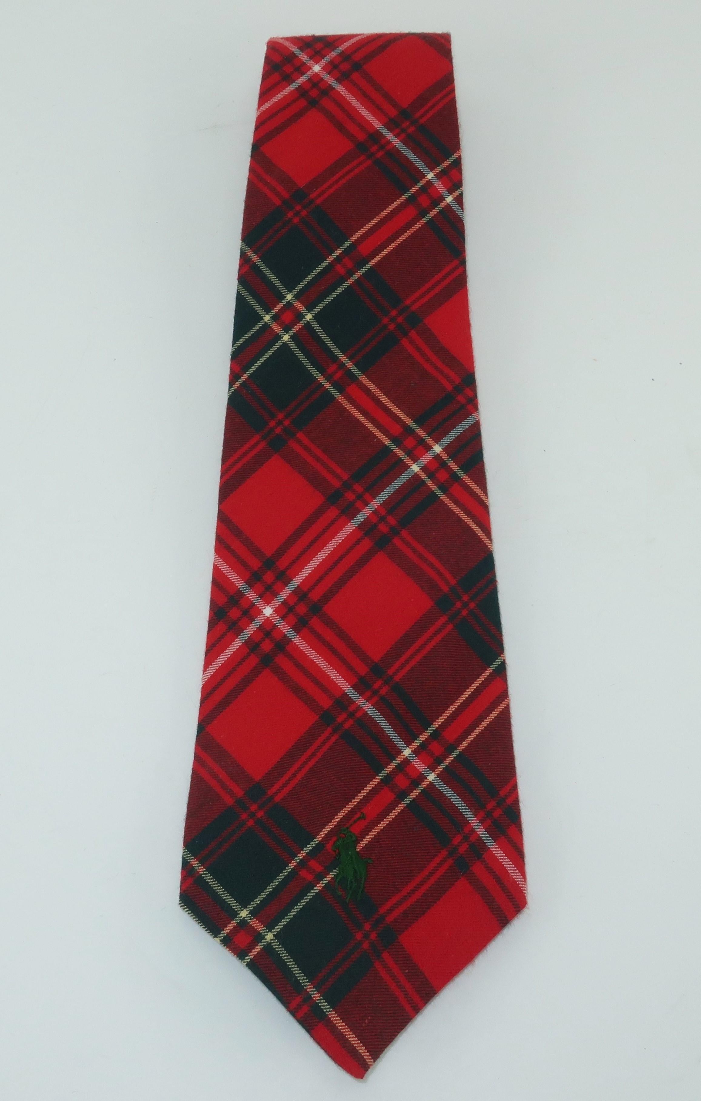 Ralph Lauren creates all-American good looks and a nod to a Scottish past with this tartan plaid men's cotton flannel necktie.  The classic plaid combines shades of red and dark green with just a touch of white with yellow perfect for creating a