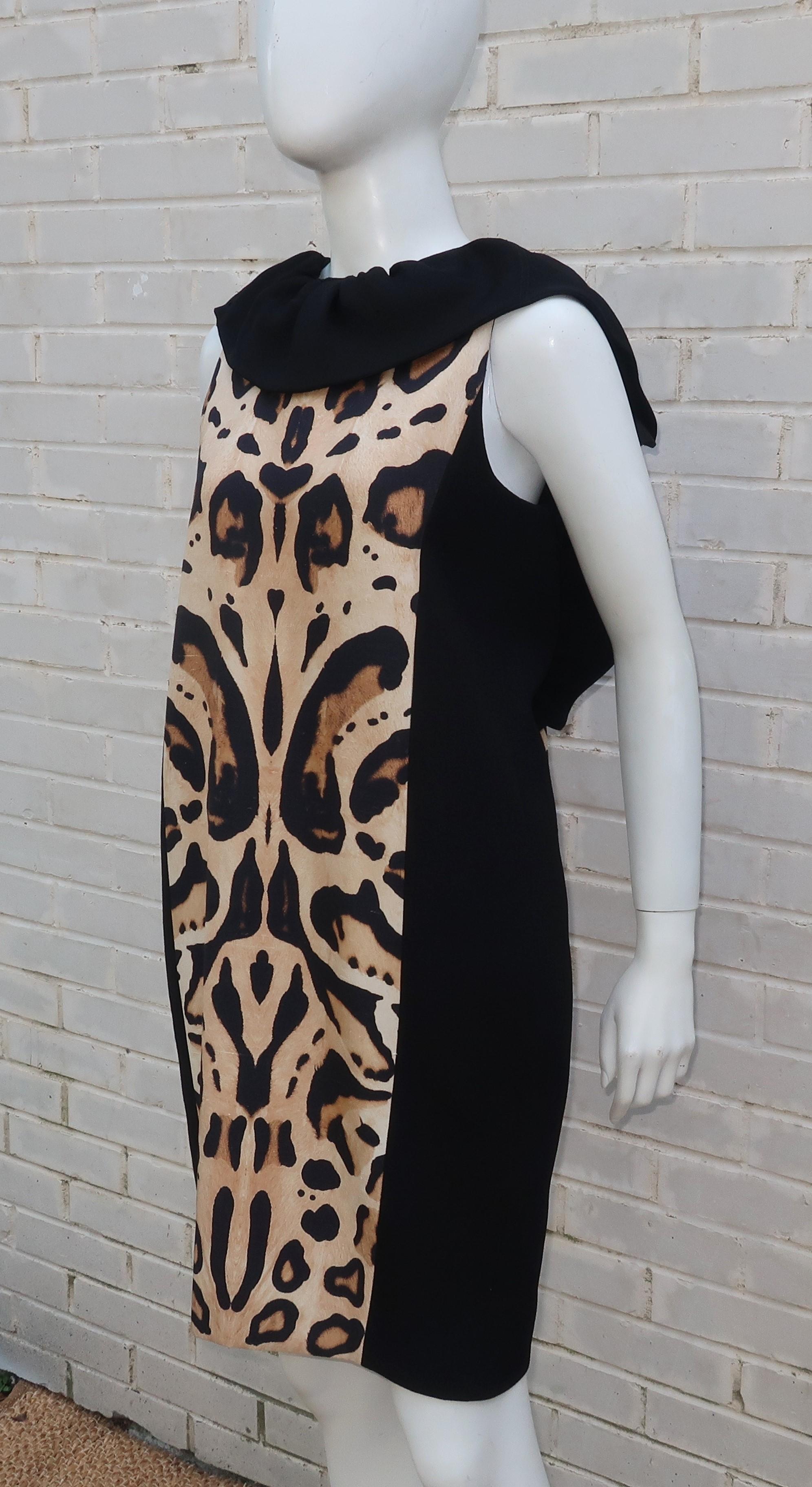 This Giambattista Valli dress combines visual graphics with expert tailoring and a youthful aesthetic.  The sheath style dress is a combination of a textured nubby black linen and an animal print that has textured characteristics of dupioni silk,