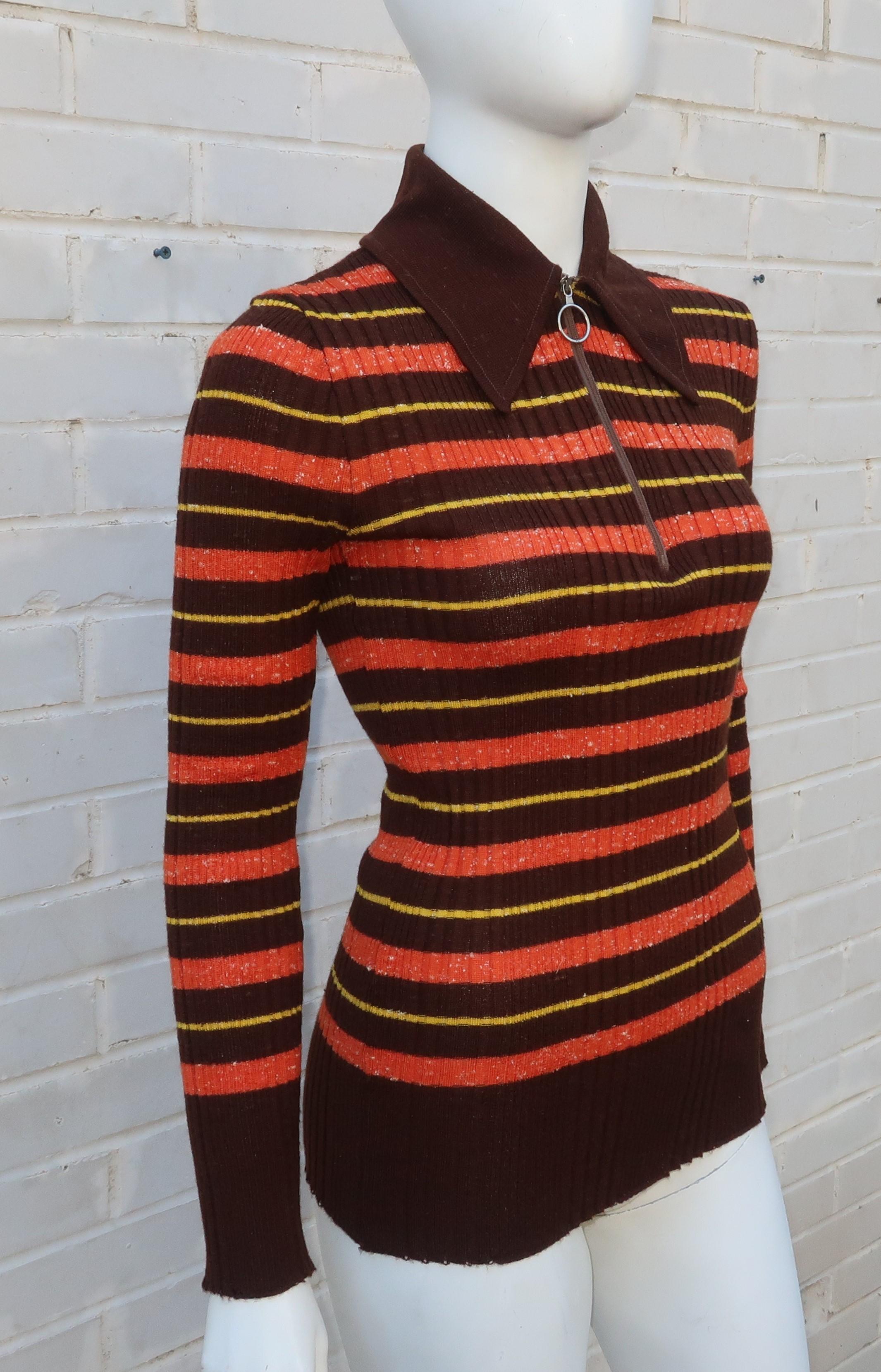 This 1970's ribbed knit Italian Elli top designed by Europecraft is a period perfect sporty look to pair with your favorite wide legged jeans.  The pullover construction and body conscious cling provides comfort and a sassy style with a ringed