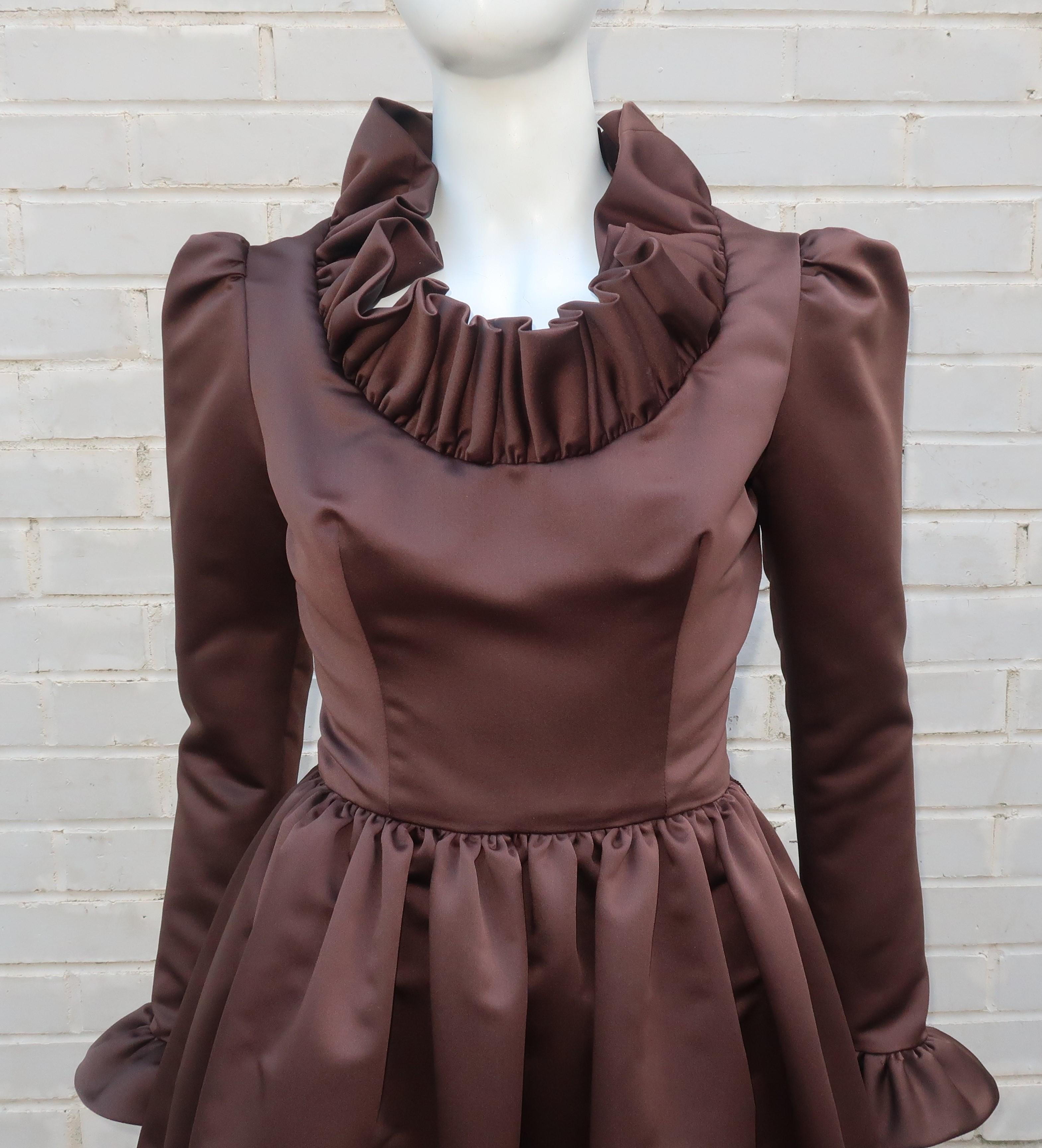 Jill Richards, the California designer of this fabulous 1970's cocktail dress, had the well earned nickname of 'Ruffles Richards' with both a flair for drama and flattering silhouettes.  The dress is fabricated from a rich chocolate brown satin