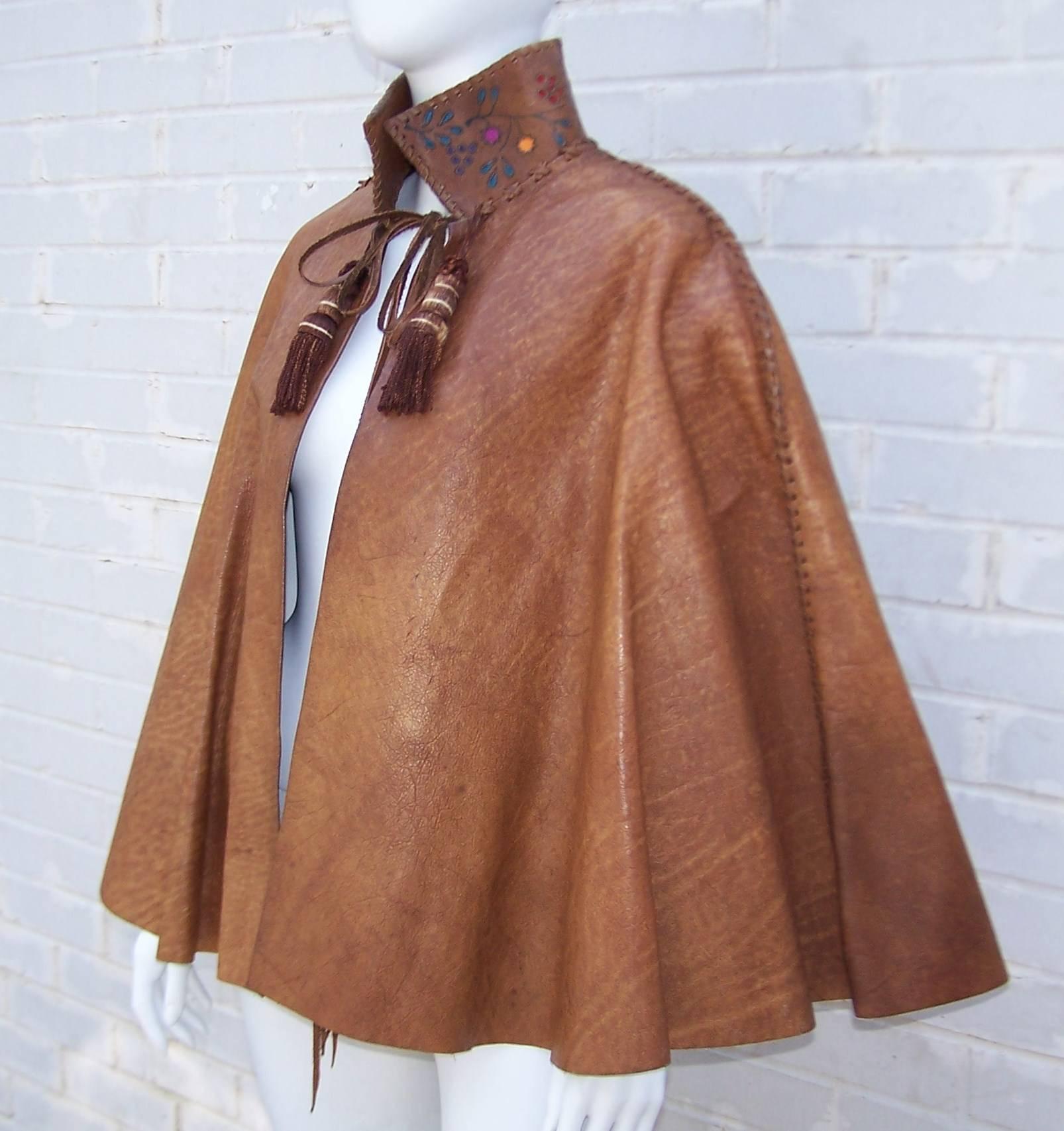 Fred Leighton, red carpet jewelry designer, collaborated with Char in the early 1970s to create this dramatic bohemian leather cape.  The cape is held in place by interior shoulder straps, closes with silk covered wooden tassels and bears colorful