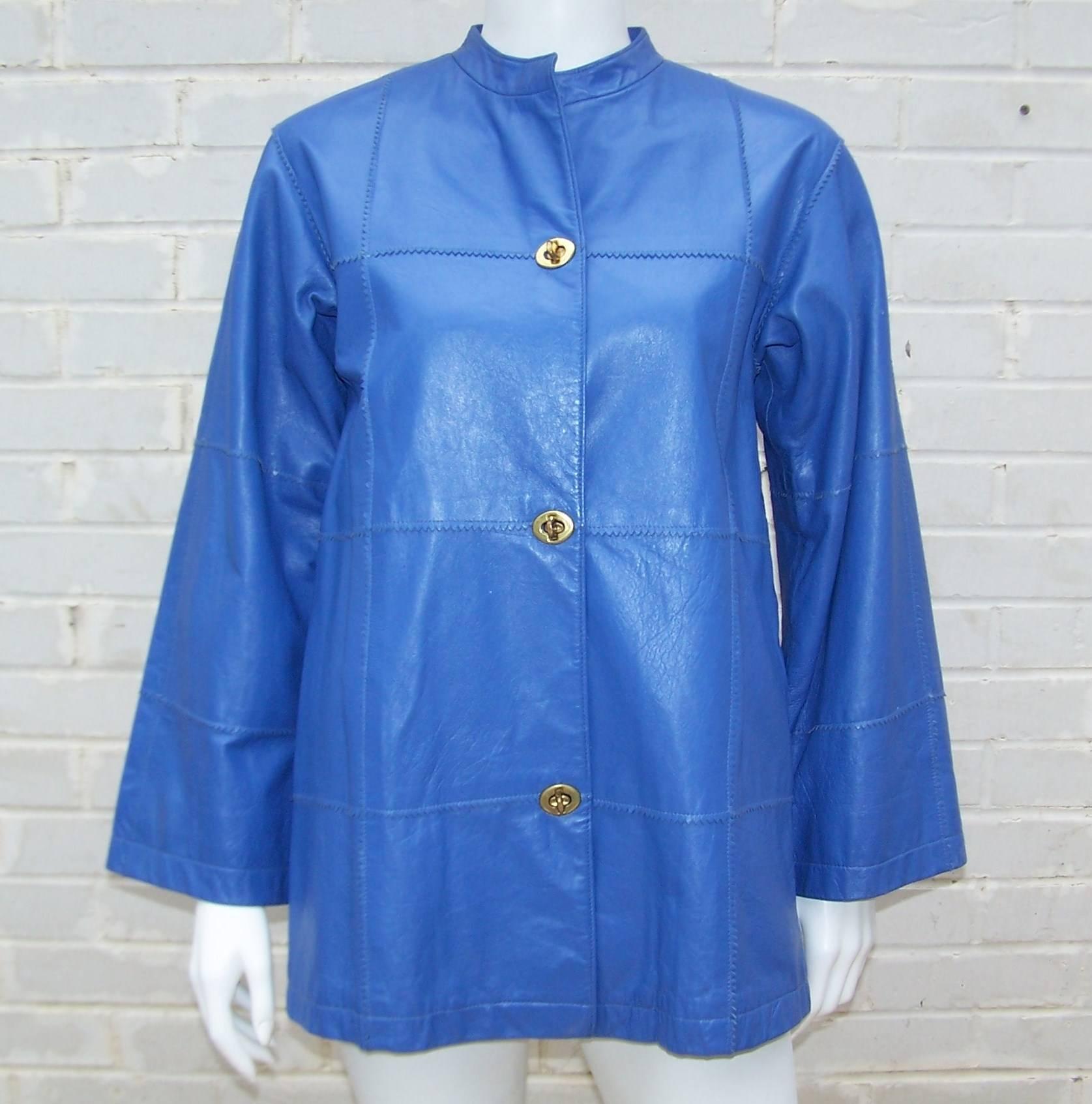 This brilliant periwinkle blue leather jacket is by quintessential American designer, Bonnie Cashin.  Designed for Sills c.1970, the jacket originally retailed at Saks Fifth Avenue and features pinked patchwork panels, mandarin style collar, bell