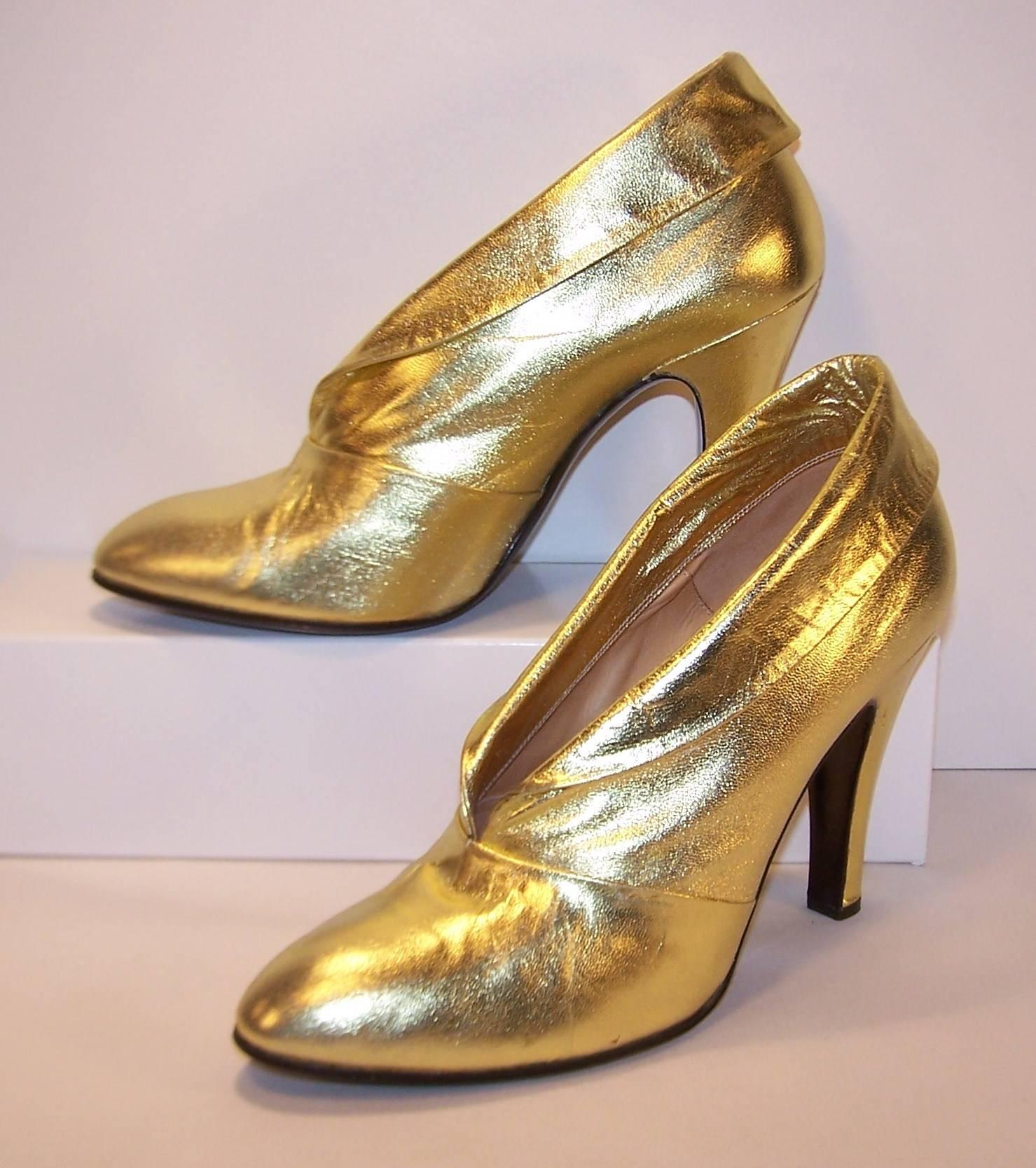 Fit for a disco queen, these 1976 Italian gold leather booties by Sergio Rossi, reign supreme.  The 4.25