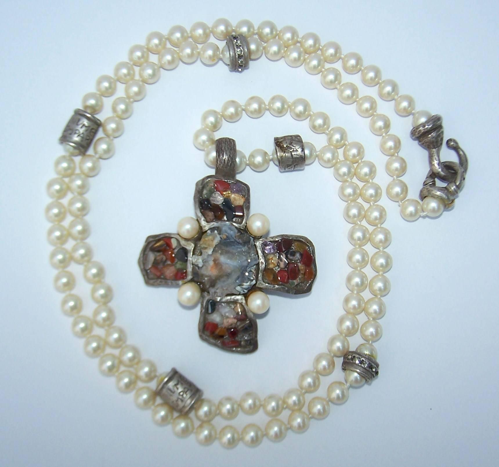 Brutalism and elegance are expertly mixed in this opera length faux pearl necklace by Gerard Yosca from the 1980's.  Mr. Yosca is know for his artisan jewelry and continues to design beautiful pieces today.  This necklace measures 42