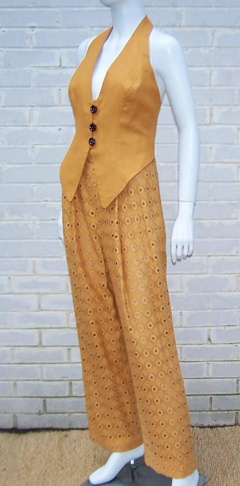 Bob Mackie has managed to make menswear look feminine and sassy with this 3-piece pant ensemble for his Collection II line.  The pumpkin color linen halter is fully lined and sports contrasting buttons with a menswear style waistcoat front.  It can