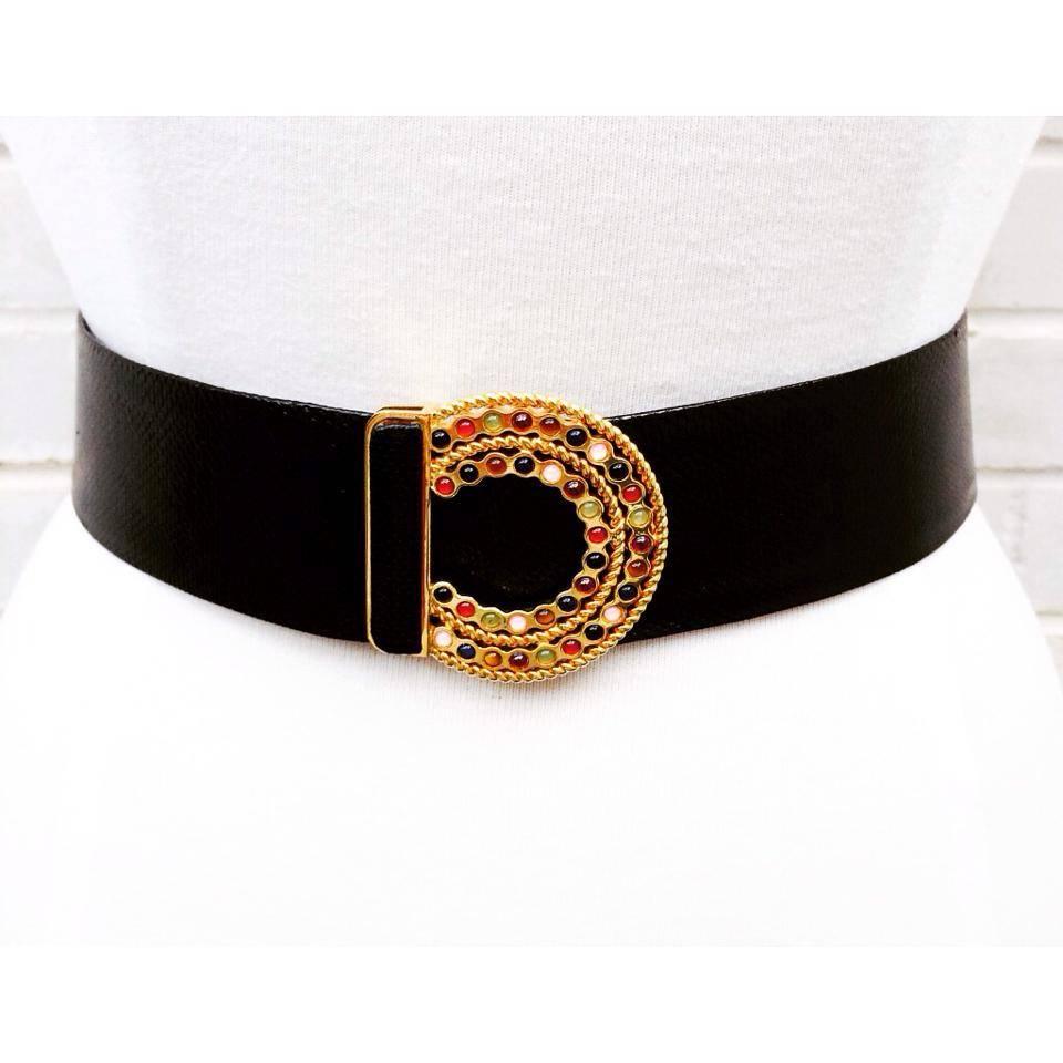 Classy and classic!  This beautiful Judith Leiber belt could be the finishing touch on an outfit or a stand alone focal point for an all black ensemble.  The black lizard belt is easily adjustable to accommodate various sizes and securely hooks in