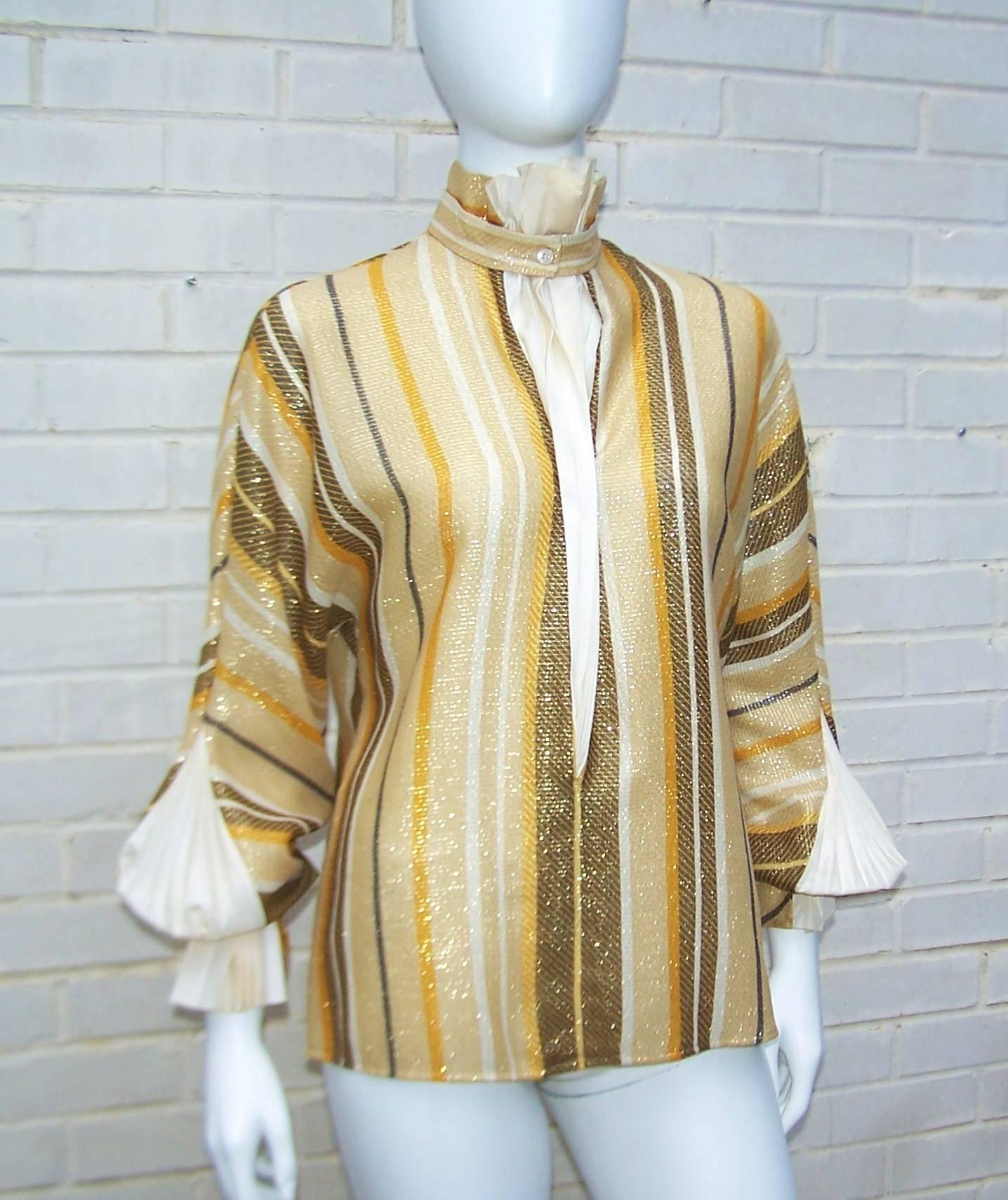 The details on this Gianfranco Ferre blouse from the 1980's are amazing.  The gold lurex fabric is a lightweight wool blend which is the perfect weight for wearing on its own or as part of an ensemble.  The neckline and cuffs are accented with silk