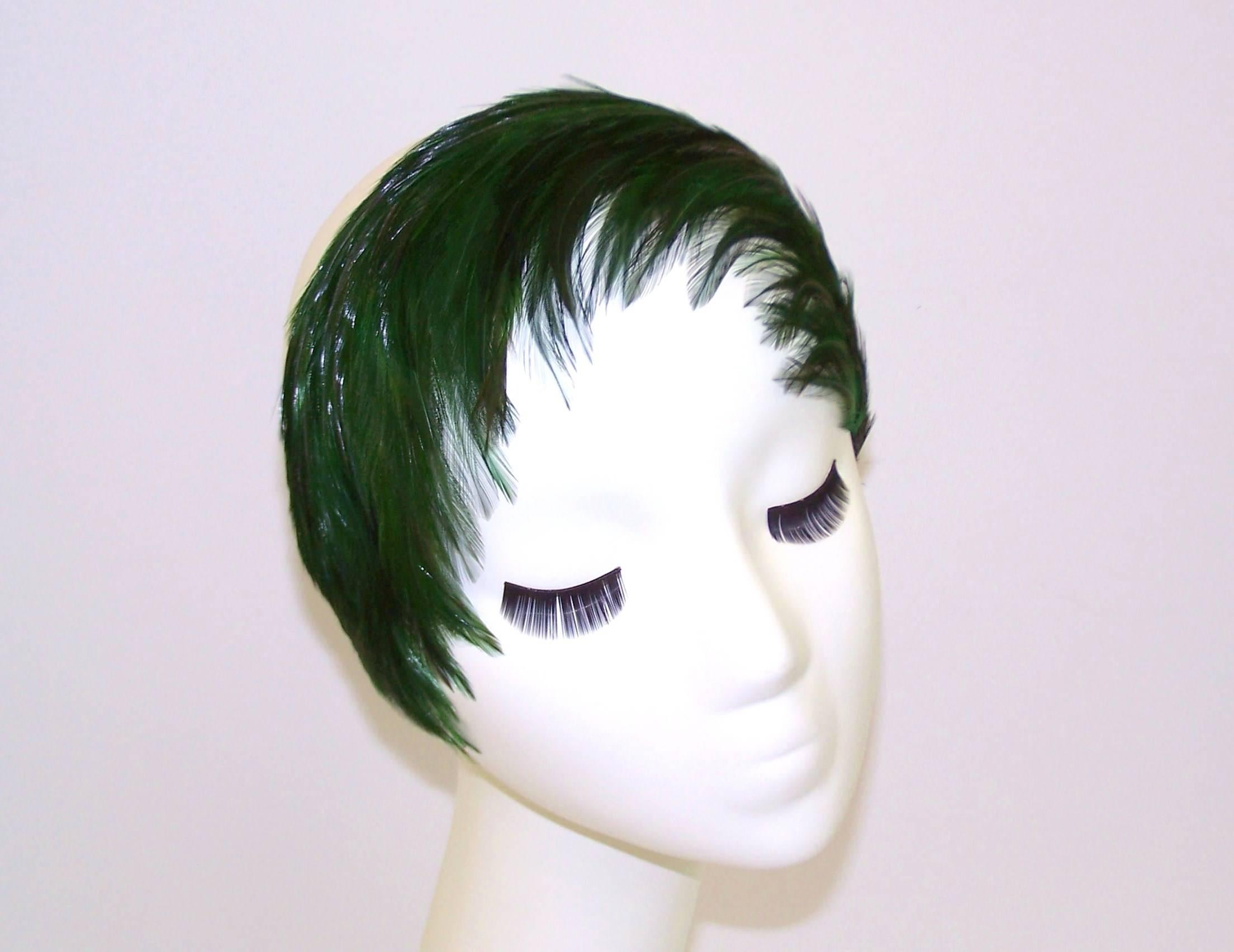 Don this headband for instant emerald green feather bangs!  The look is so versatile...wear it backwards, forwards, pushed up or back...for an instant touch of chic.  The grosgrain covered headband fits many sizes and can even be worn as a collar