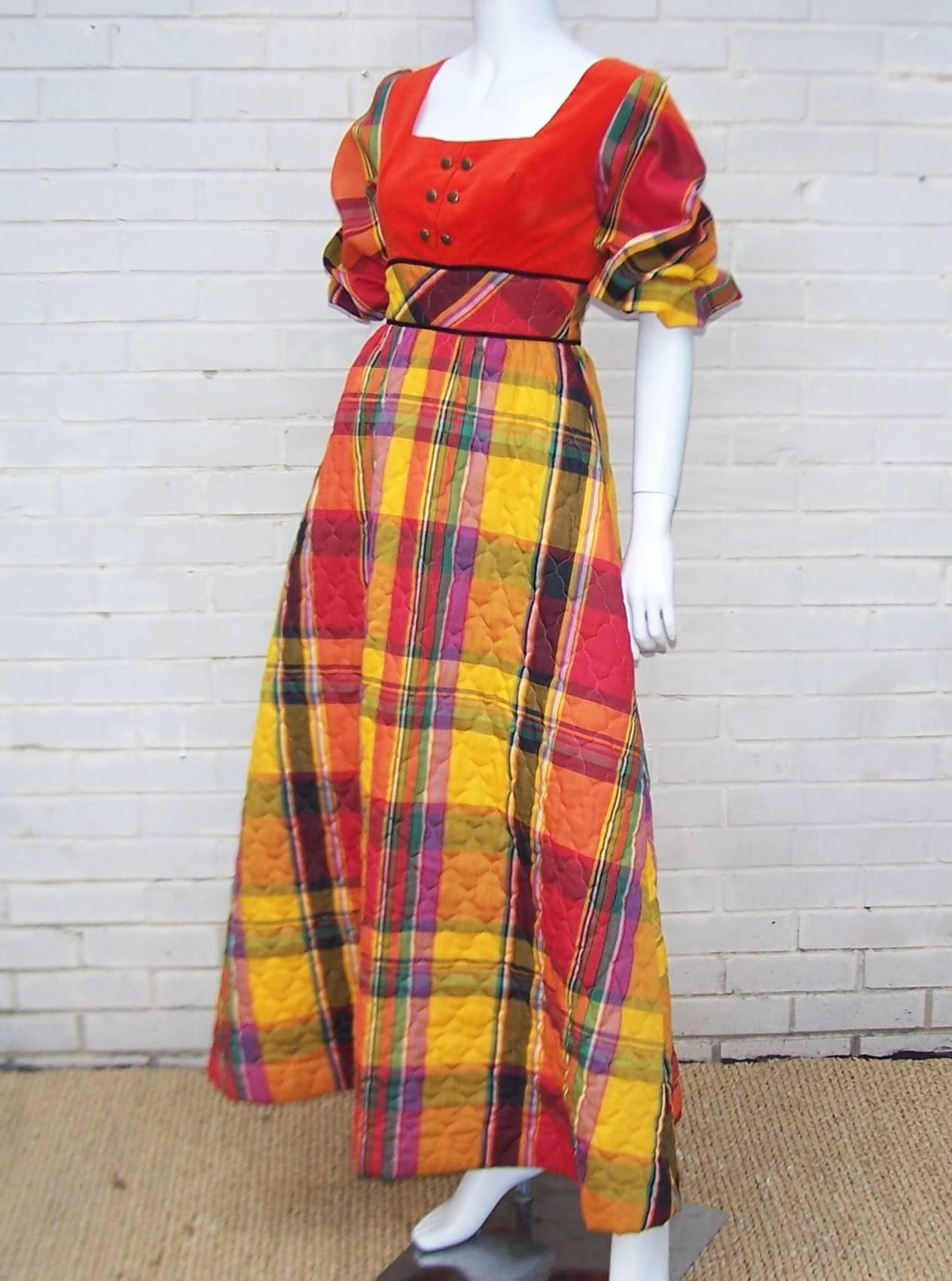 Only Saks Fifth Avenue could whip a plaid quilted bedspread up into an adorable hostess dress fit for entertaining or just relaxing by the fire.  The velvet bodice is fitted and embellished with mirror backed metal buttons while the full a-line