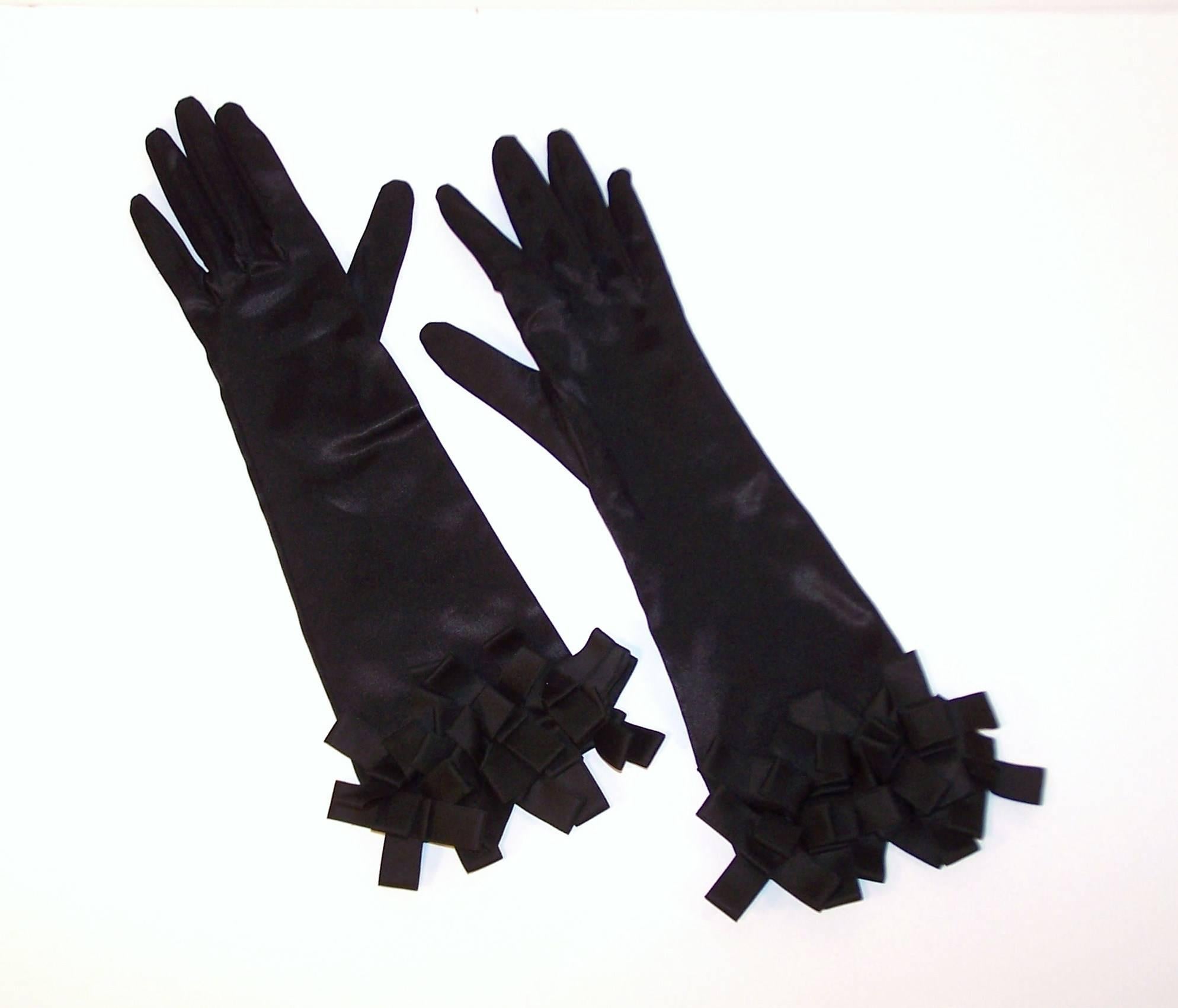 These black satin stretch evening gloves are sleek and alluring.  The glamorous  3/4