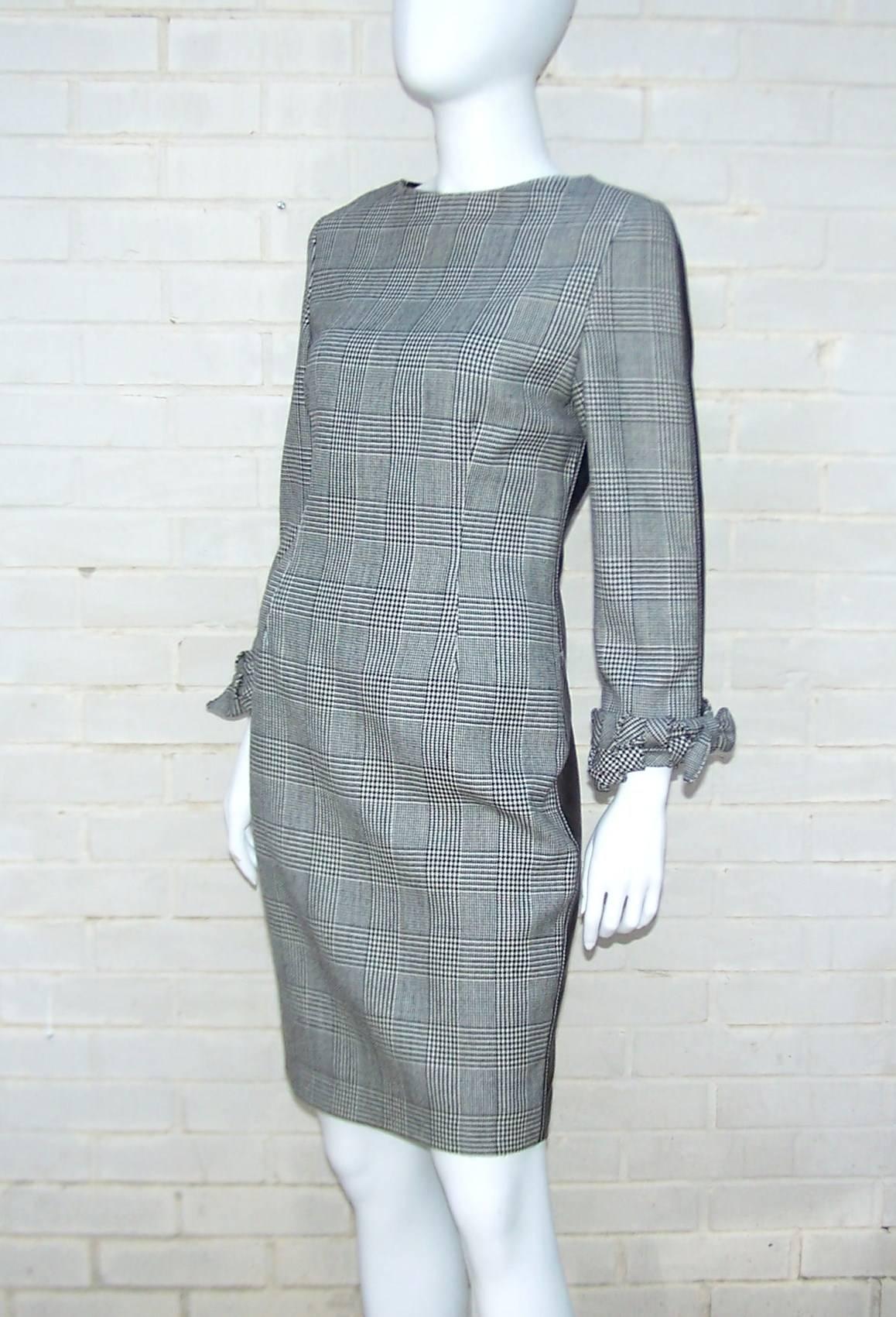 Wowza!  Make a ladylike impression from the front with a demure glen plaid wool dress and then catch their attention with form fitting black leather at the back.  The white contrast stitching on the leather and the lovely basket weave cuffs on the
