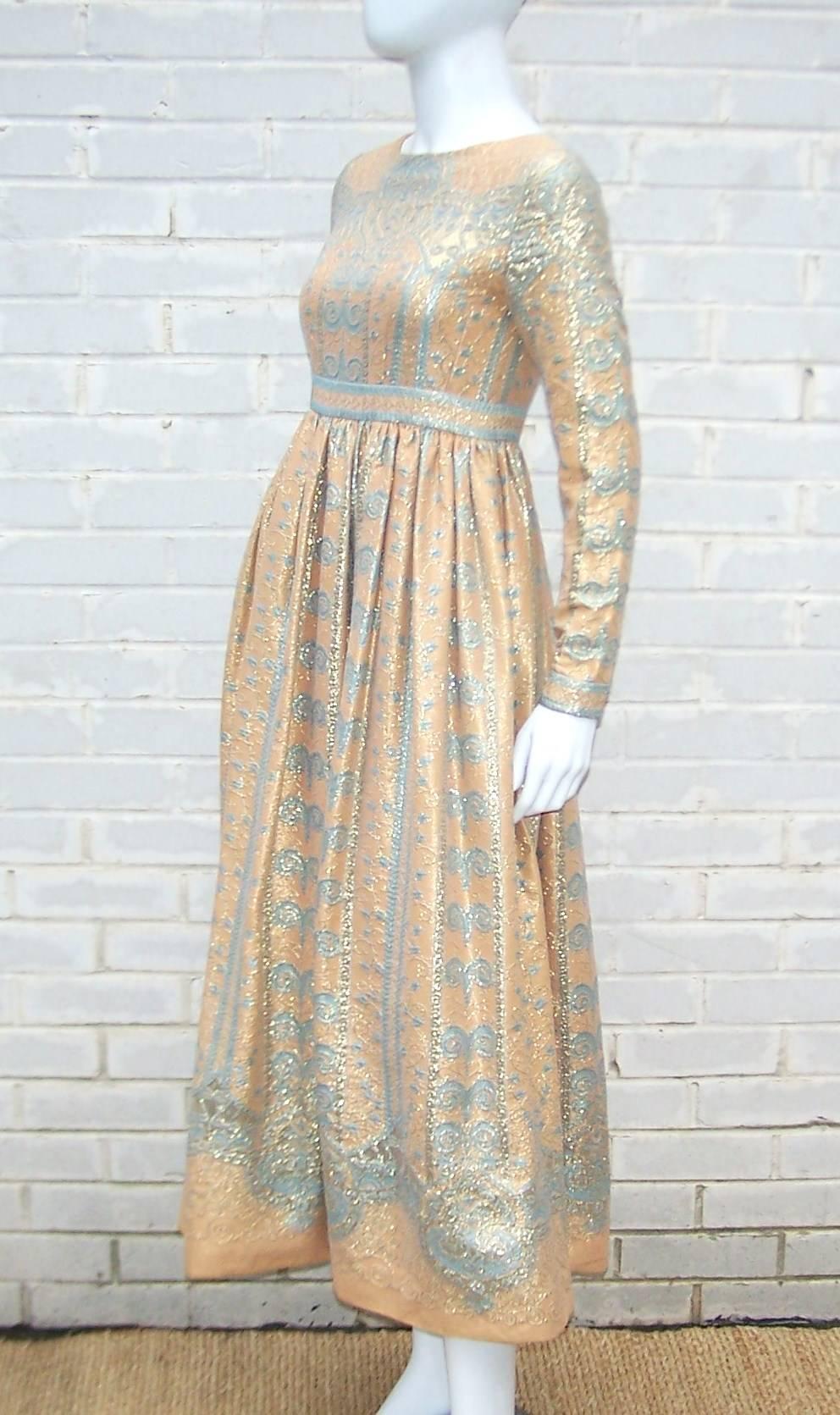 Gorgeous!  This Jeannene Booher designed dress for Jennifer is poetry in motion.  The exotic fabric creates a nude illusion effect by layering gold brocade with a light aqua blue design over a flesh-tone background.  The fabric is expertly nipped