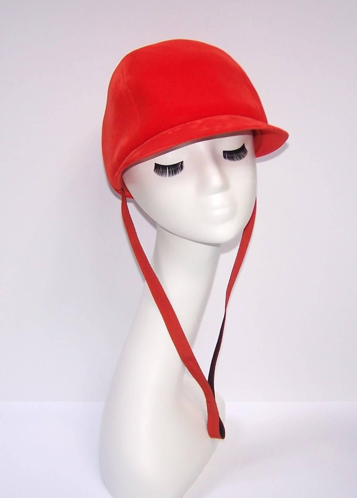 And she's off!...coming down the stretch in her adorable Adolfo red velvet hat...and It's a winner!  This hat is a buttery soft plush velvet in a bright orangey red that is almost neon.  It has a reversible black and red grosgrain ribbon neck strap