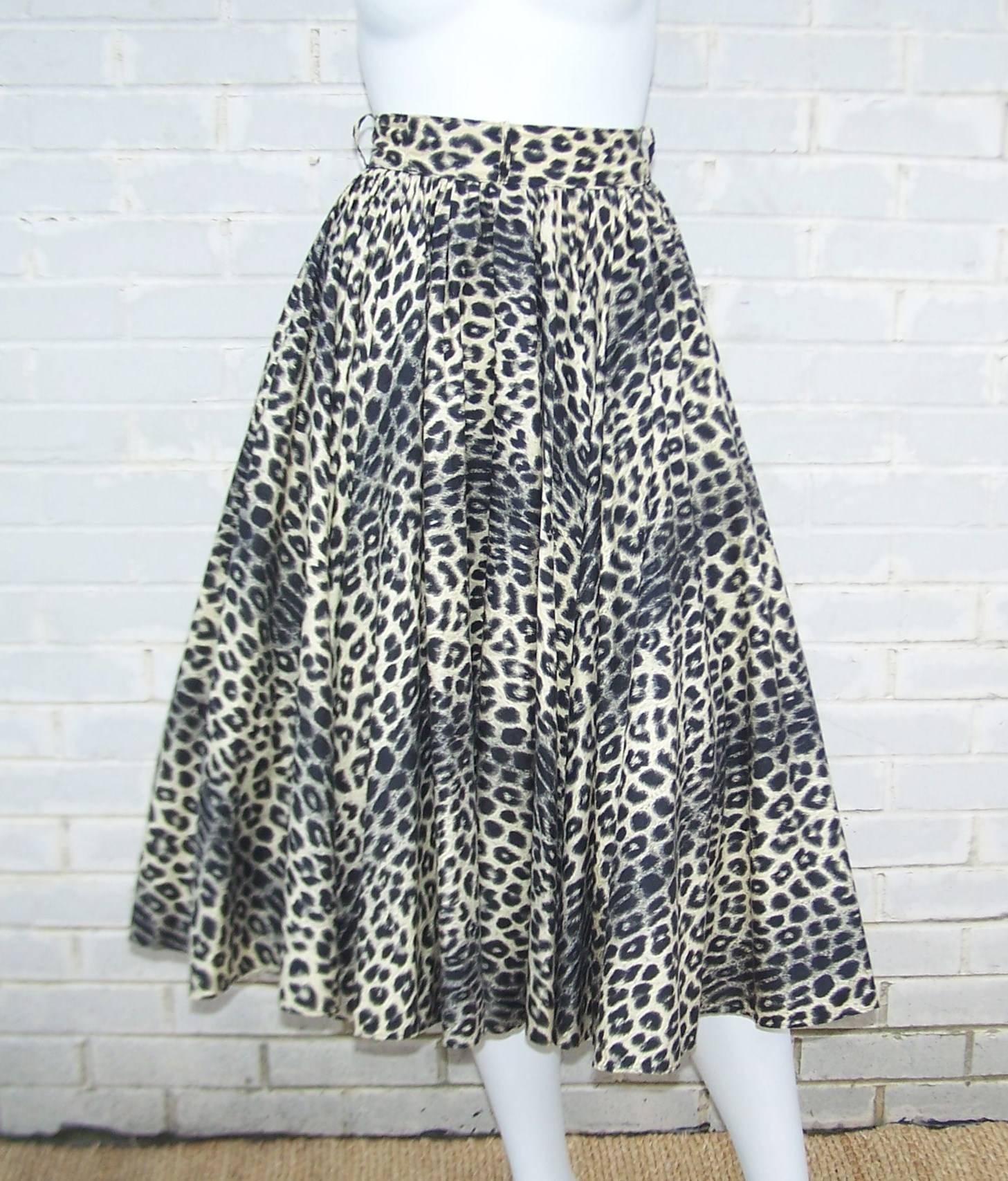 Stalk your prey in this 1950's black leopard print circle skirt.  The full skirt cinches at the waist with buttons and zipper on the side...belt loops available if you need an added touch.  The cotton fabric is a detailed trompe l'oeil leopard print