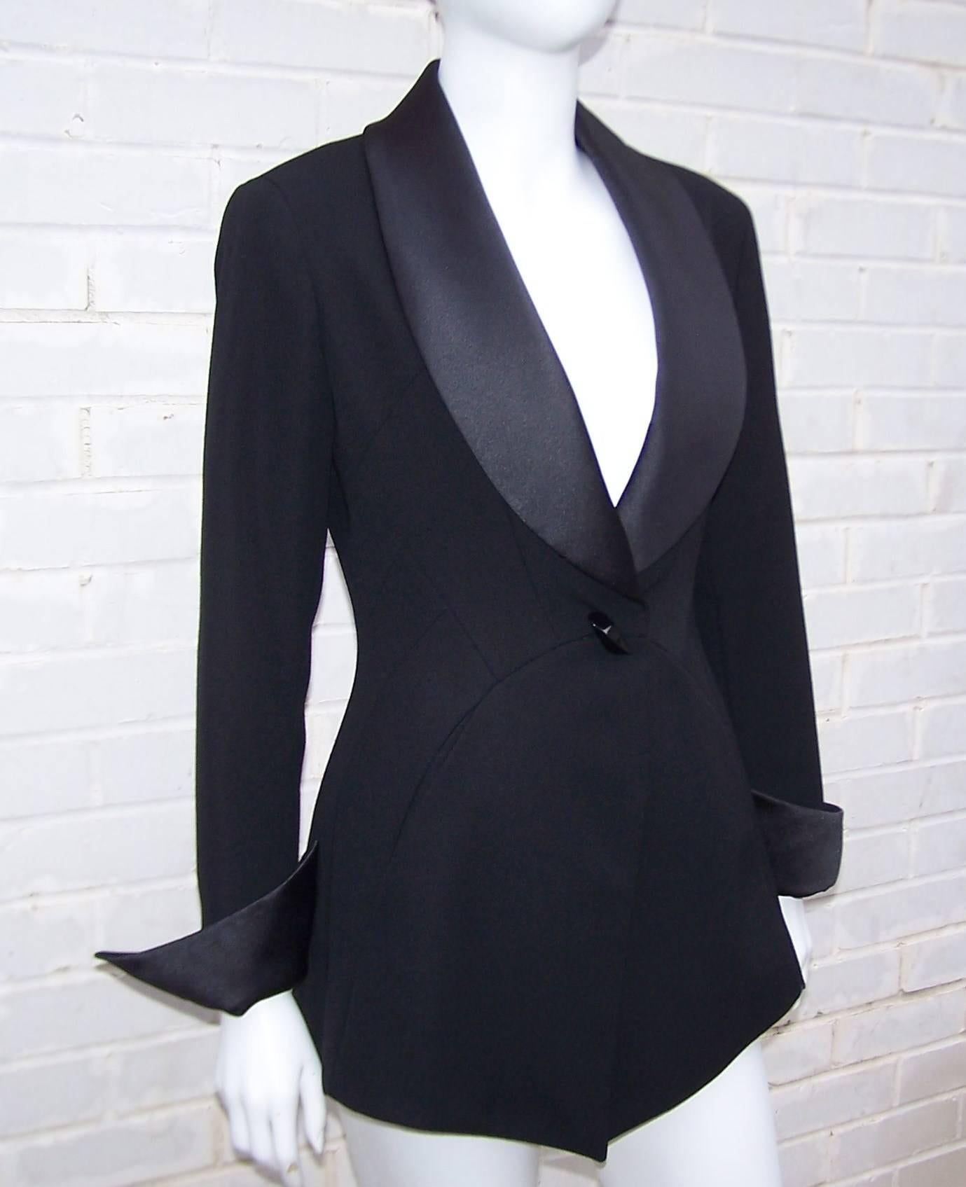A well executed design is timeless, classic and yet always dynamic...such is this tuxedo jacket by Claude Montana.  The detailed construction is evident in the seaming both at the front and back with the addition of side pockets and an elongated