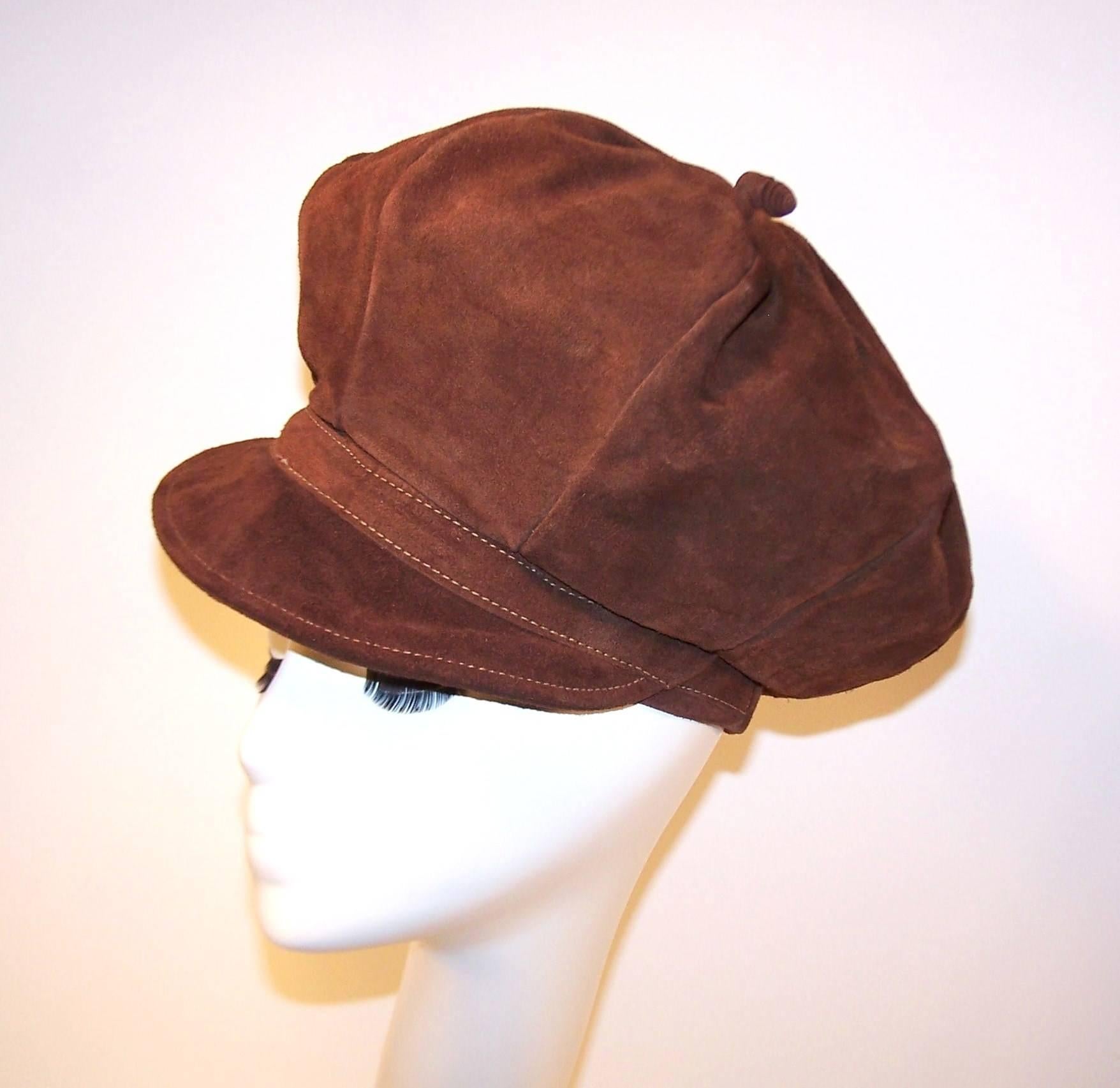 Extra! Extra!  Read all about it! This newsboy cap is reminiscent of the style made popular in the early 1900's with the added exaggeration of a tall crown to lend it a true 1970s bohemian look.  The heavy chocolate brown suede is durable though
