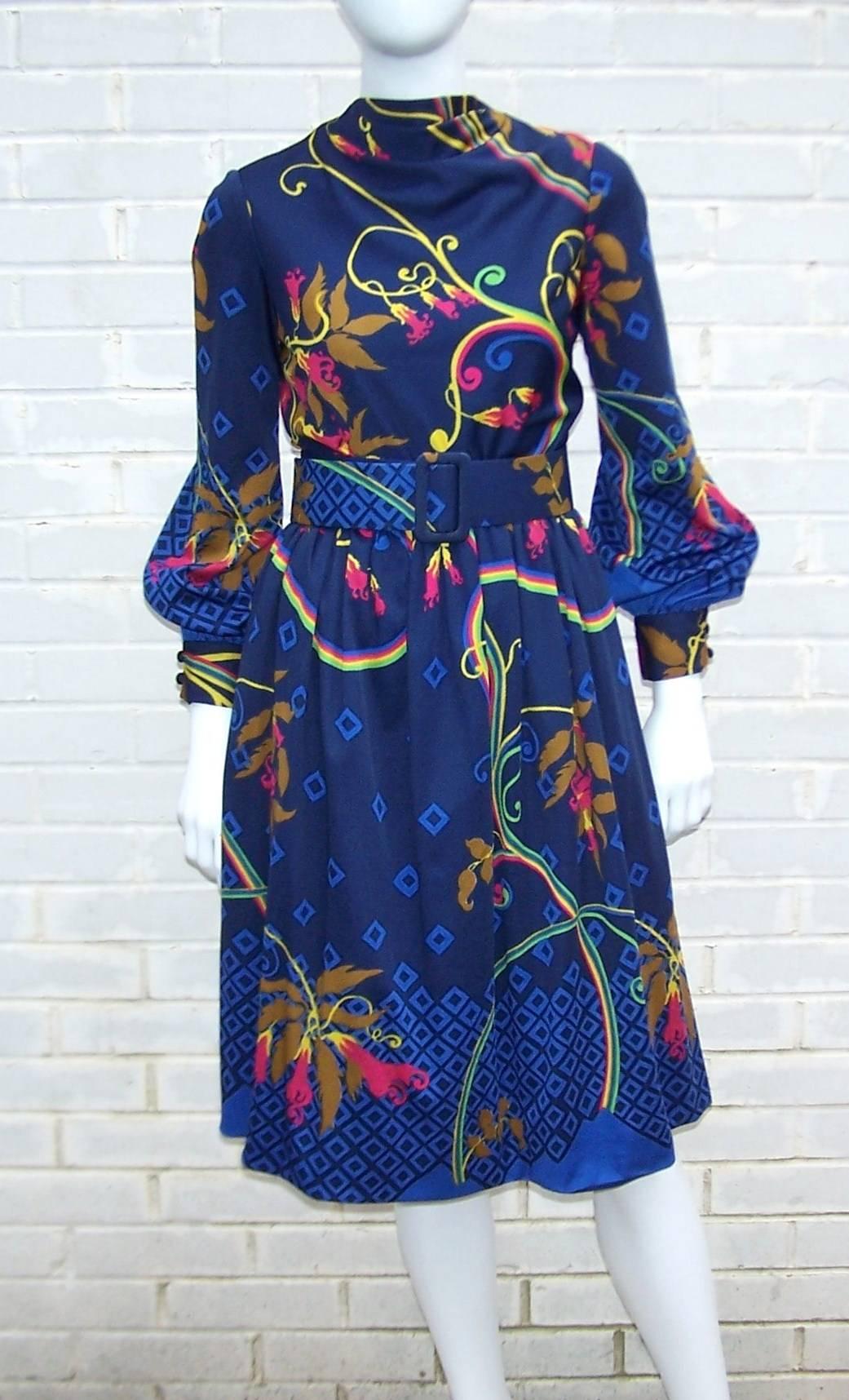 Teal Traina has updated an elegant ladylike silhouette with a mod abstract floral print in vibrant colors including blue, fuchsia, green, yellow and brown.  The fabric is a comfortable polyester jersey ... perfect for multi season wear and