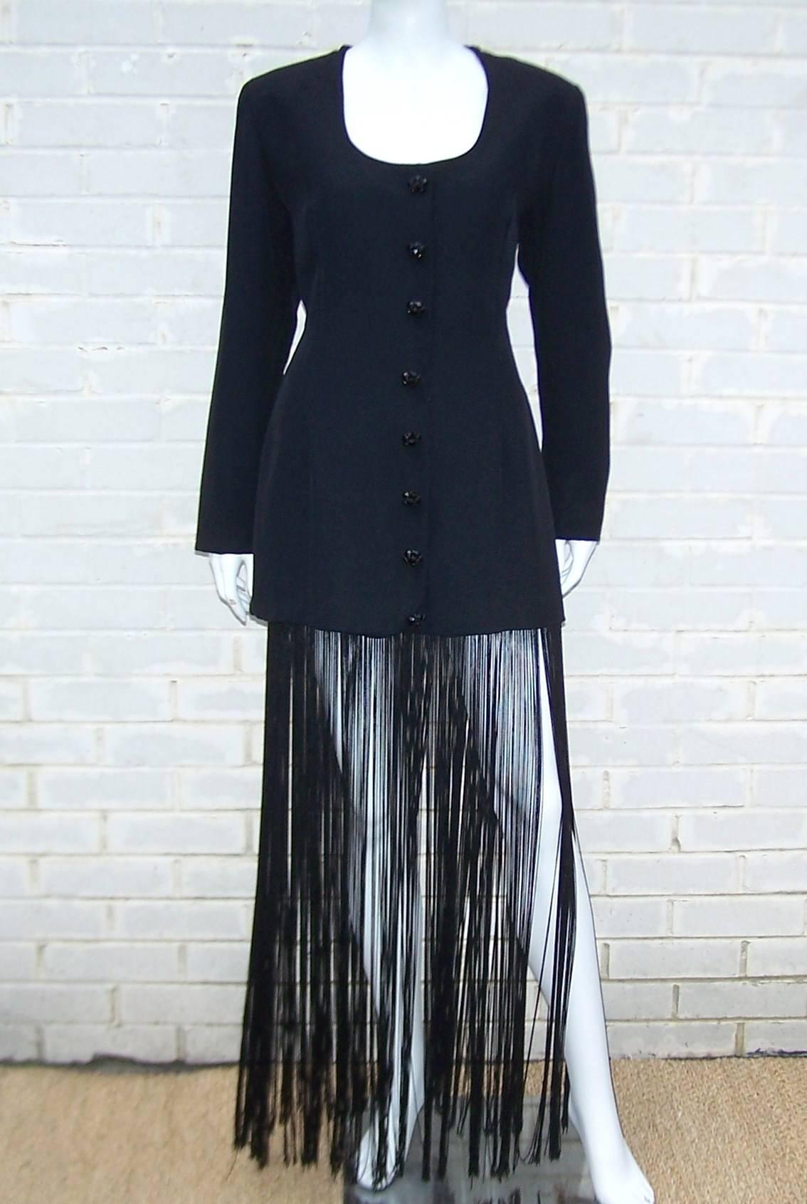 Have you ever wanted to look like a Bob Fosse dancer?!  All eyes will be on you, your gams and the seductive sway of the fringe on this black silk crepe jacket which could also be worn as a dress.  The body of the jacket is lined with scoop neck and