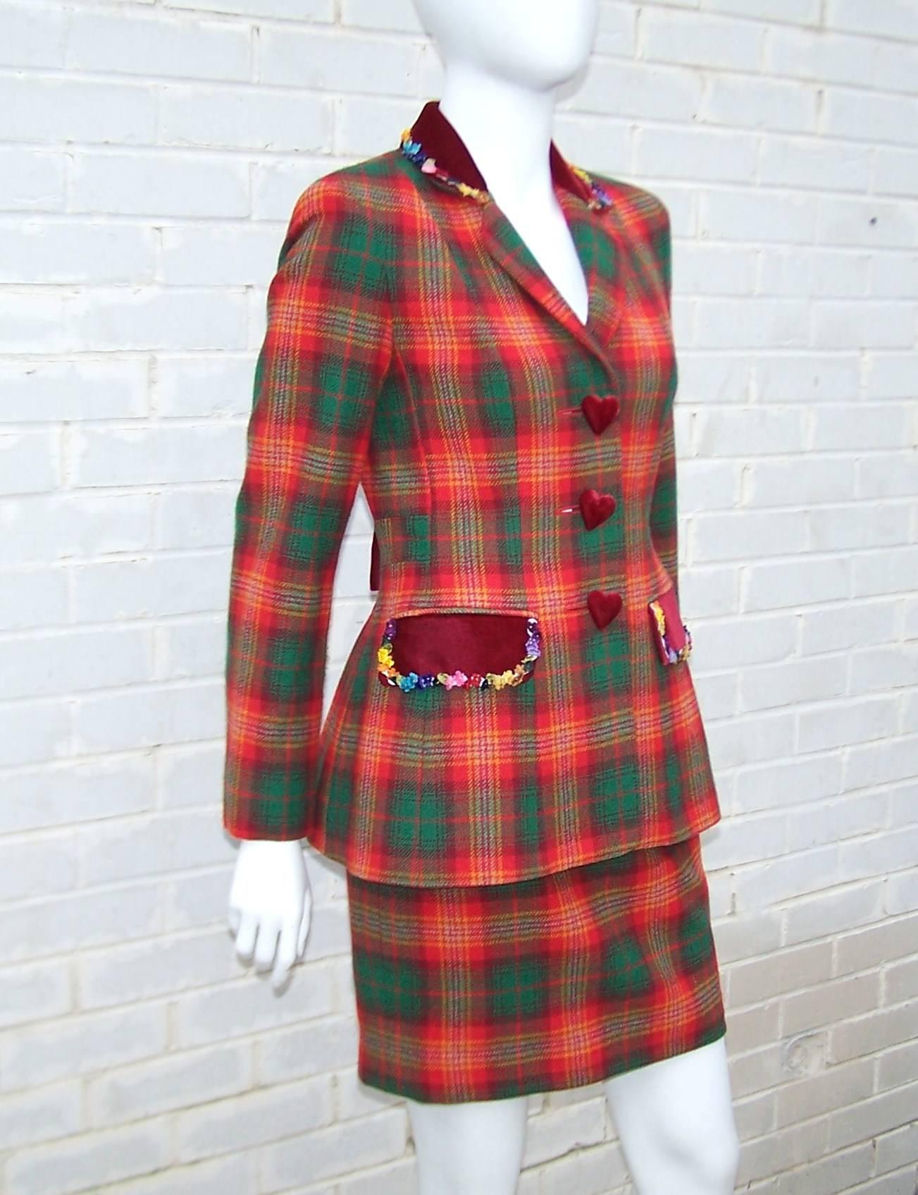 Franco Moschino has whipped up an adorable skirt suit with a mix of traditional wool tartan red and green plaid accented with slightly contrasting ruby red velvet.  True to Moschino's whimsical and sometimes irreverent style, he tweaks the